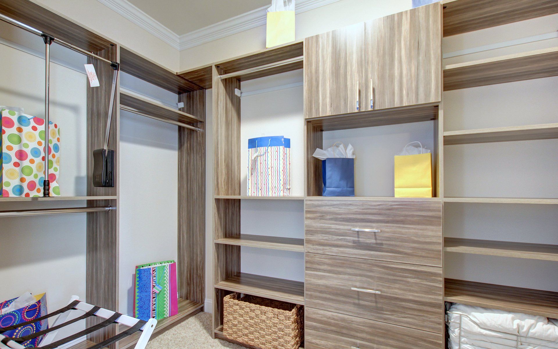 Clothes and bedding organized in a closet | Closets | Covell Communities | Chester, Maryland 21619