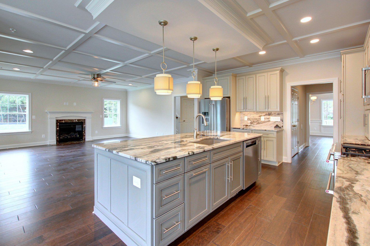 Kitchen island with lights above it hanging | Covell Communities | Chester, Maryland 21619