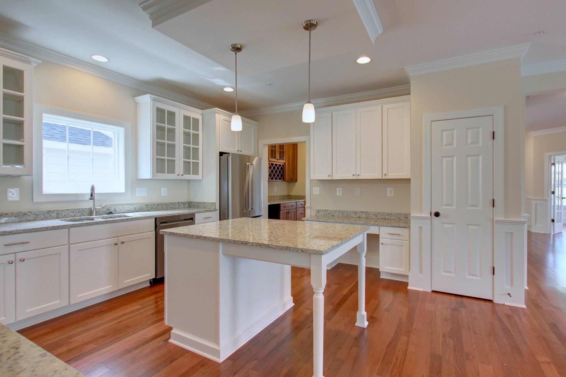 There is a large island in the middle of the kitchen.