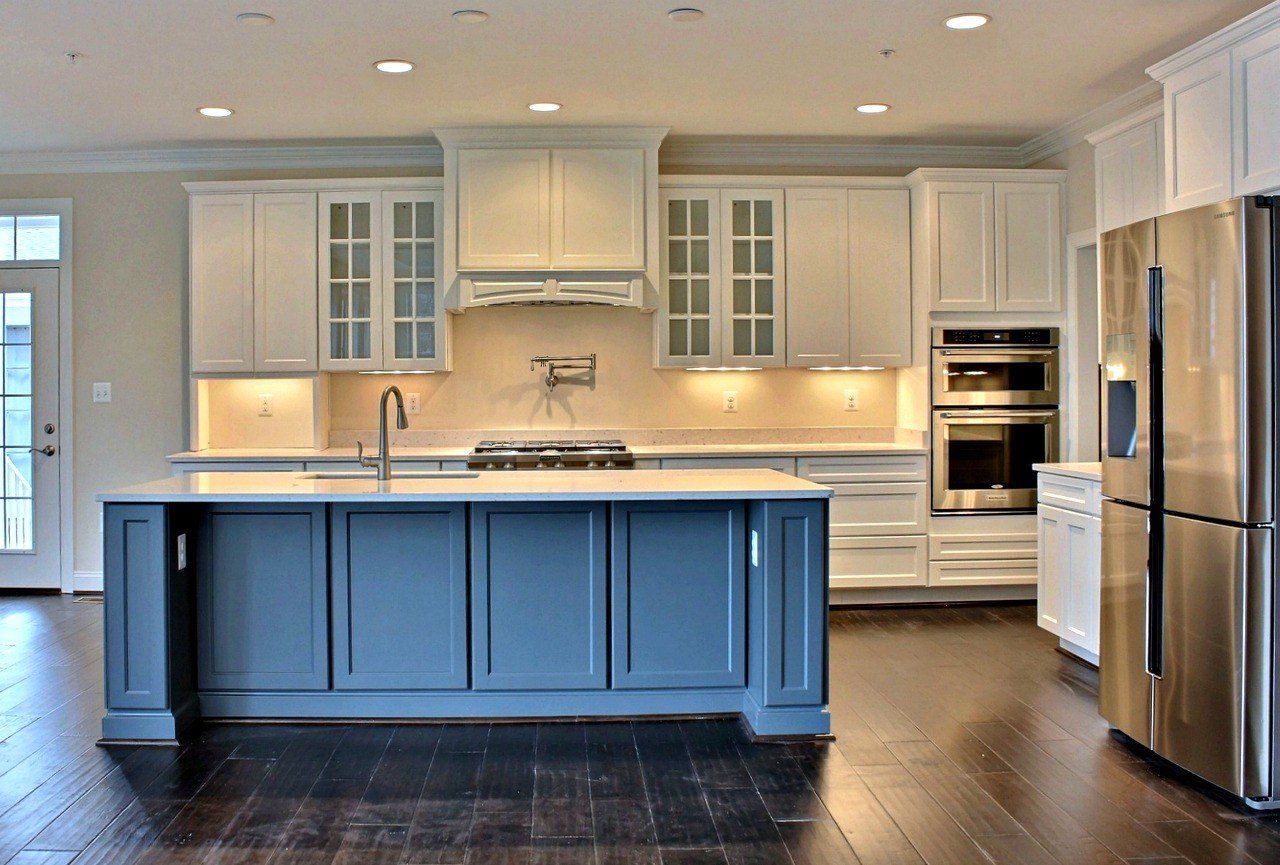 Kitchen with white cabinetry and blue island | Cabinets | Covell Communities | Chester, Maryland 21619