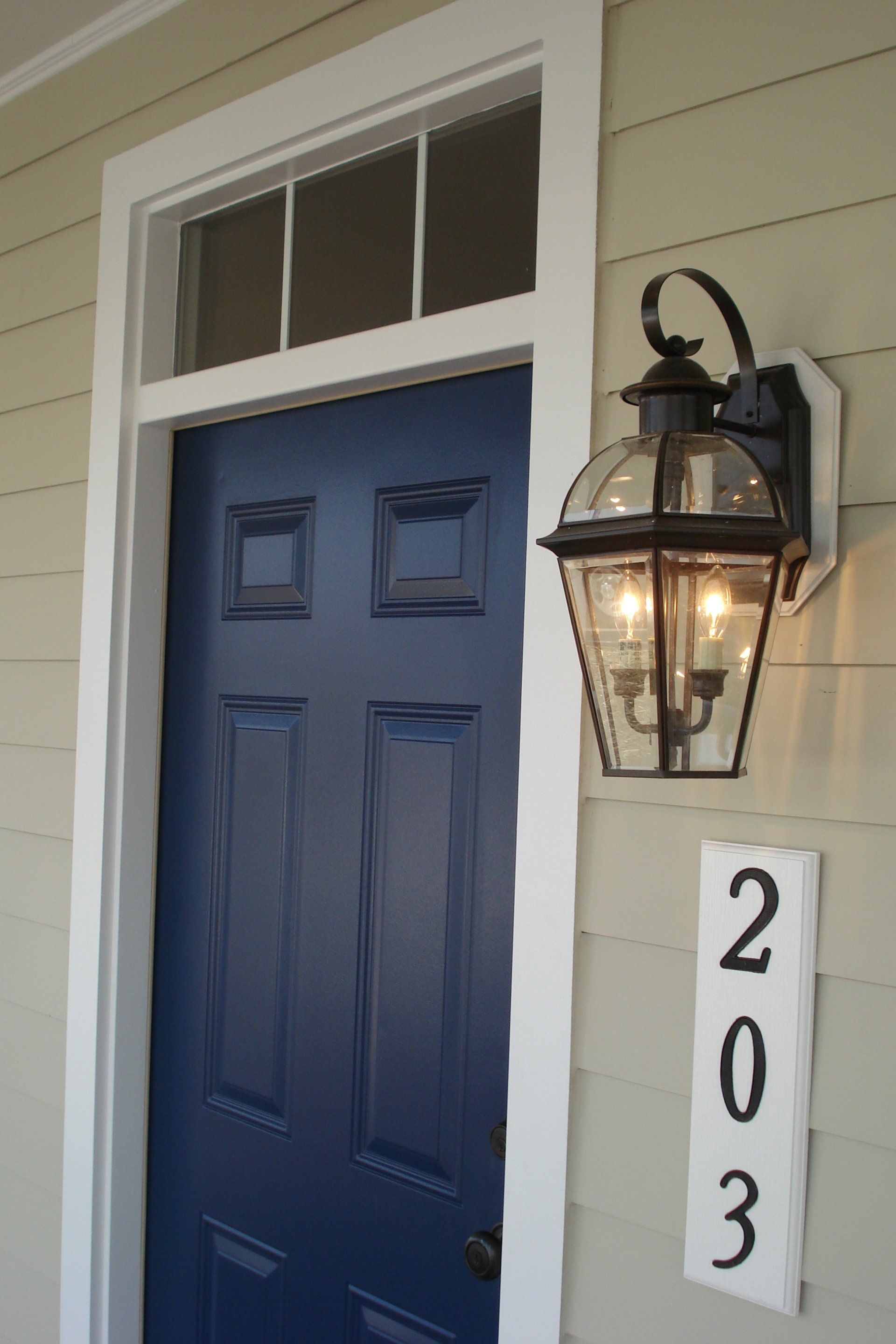 A blue door with the number 203 on it