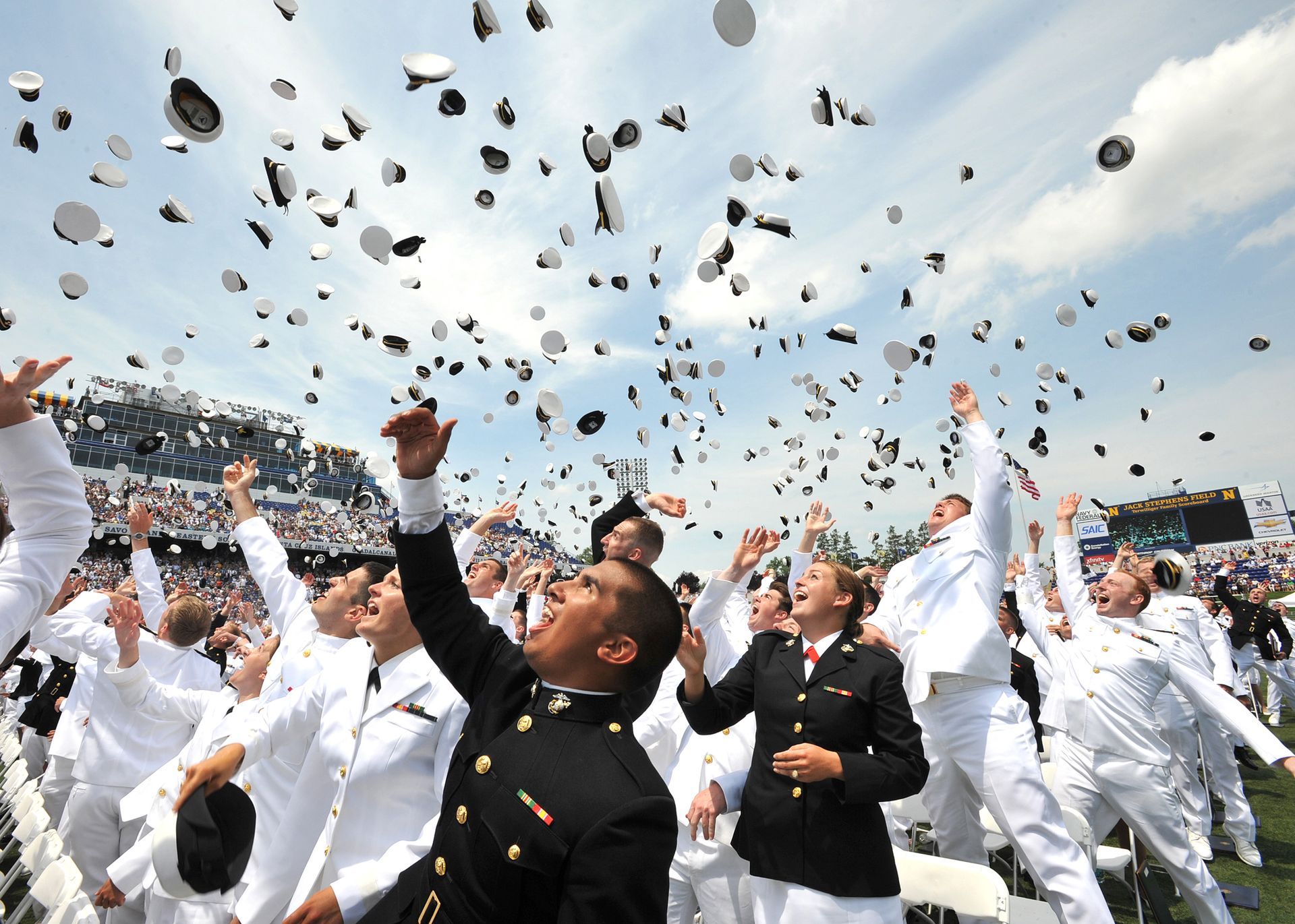 Men and Women in Navy throwing caps| Eastern Shore Culture | Covell Communities | Chester, Maryland 21619