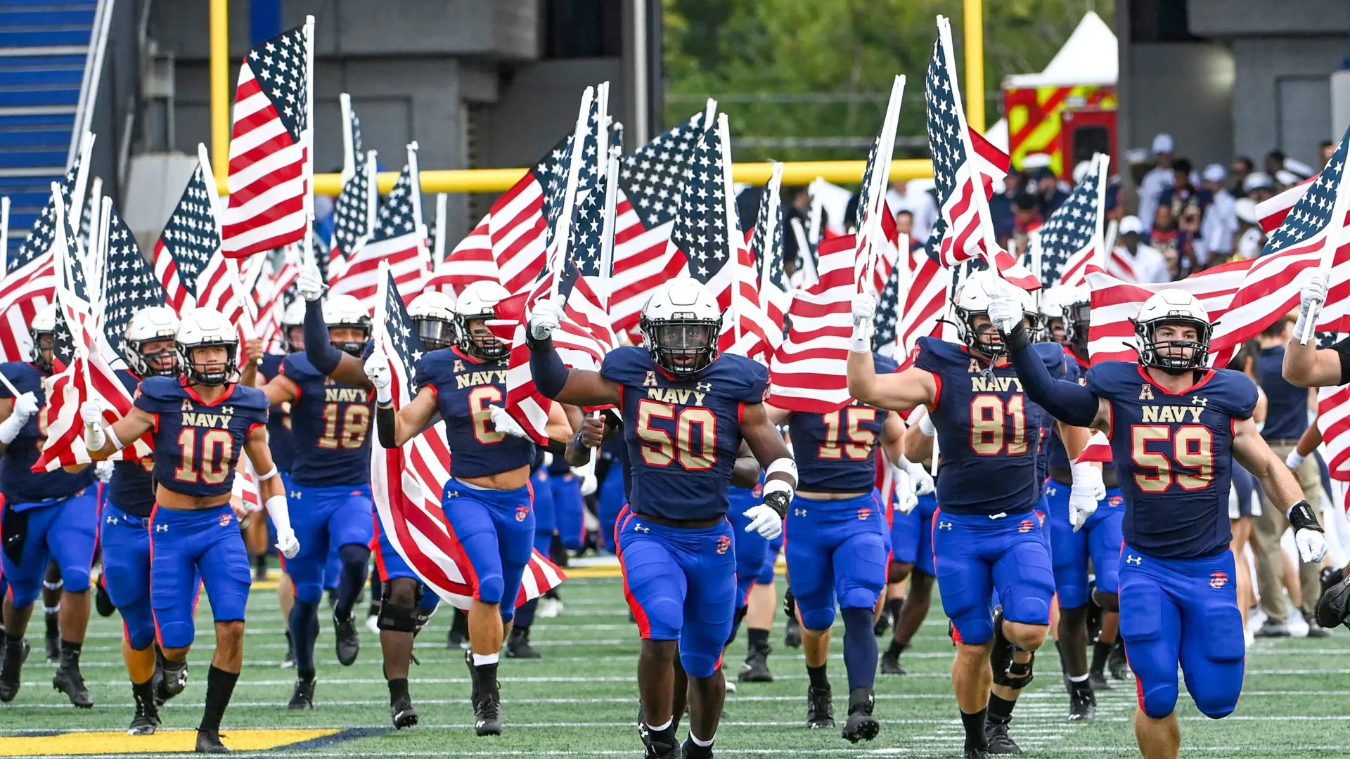 Football players waving American flags  Eastern Shore Culture | Covell Communities | Chester, Maryland 21619