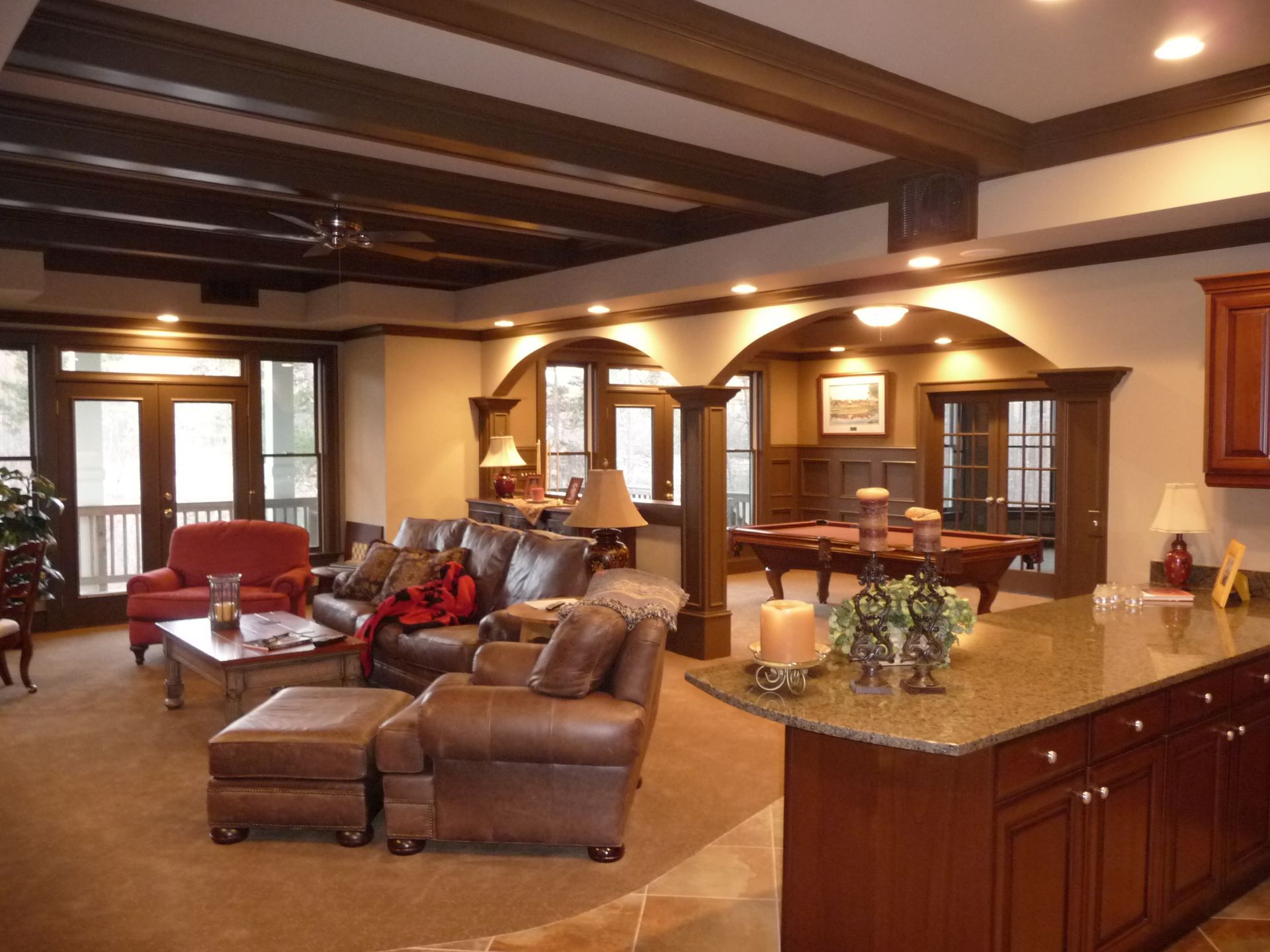 A living room filled with furniture and a pool table
