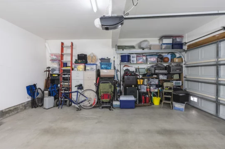 Neatly arranged suburban garage featuring a well-organized assortment of tools within a two-car space.