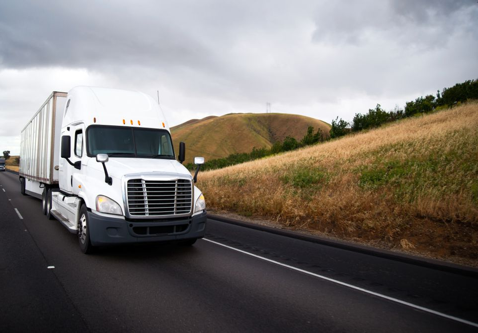 White Semi-truck Drives on a Highway — Mission Truck Training in Fraser Coast, QLD