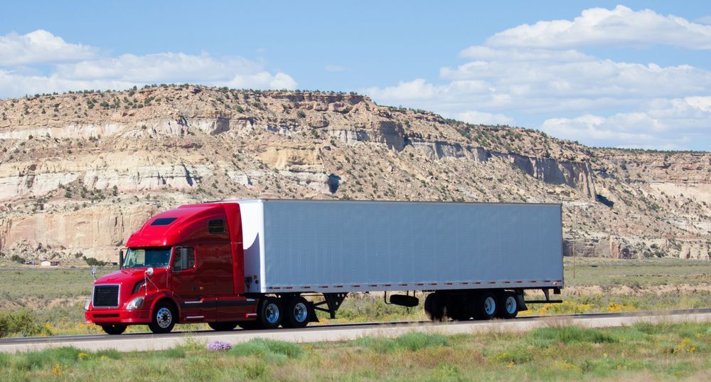 Red Semi-truck Driving on a Road — Mission Truck Training in Mountain Creek, QLD