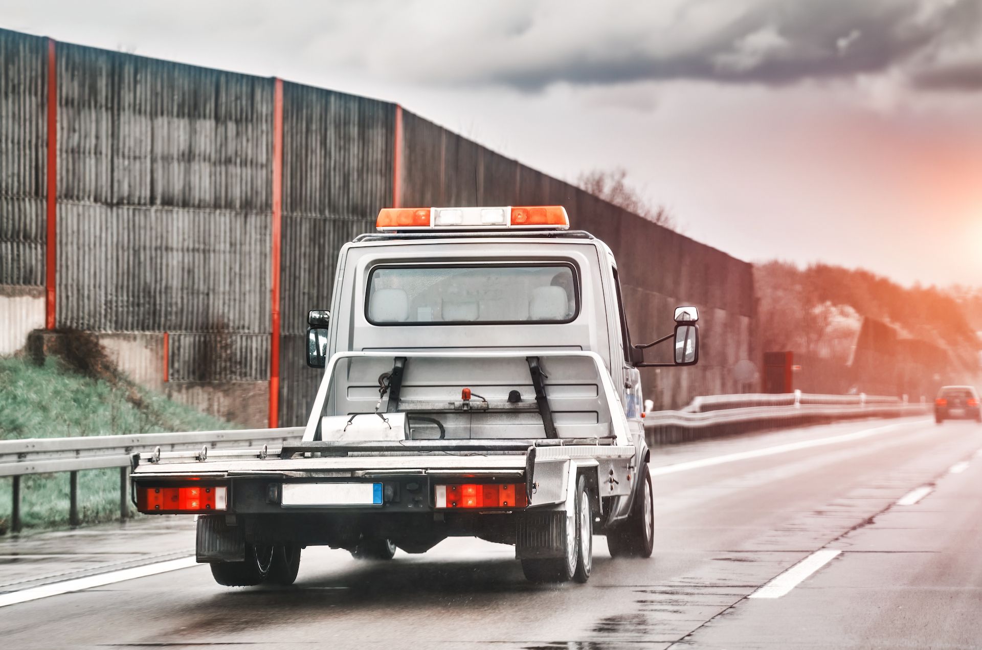 Tow Truck Driving on Highway, Orange Flashing Light — Mission Truck Training in Gympie, QLD