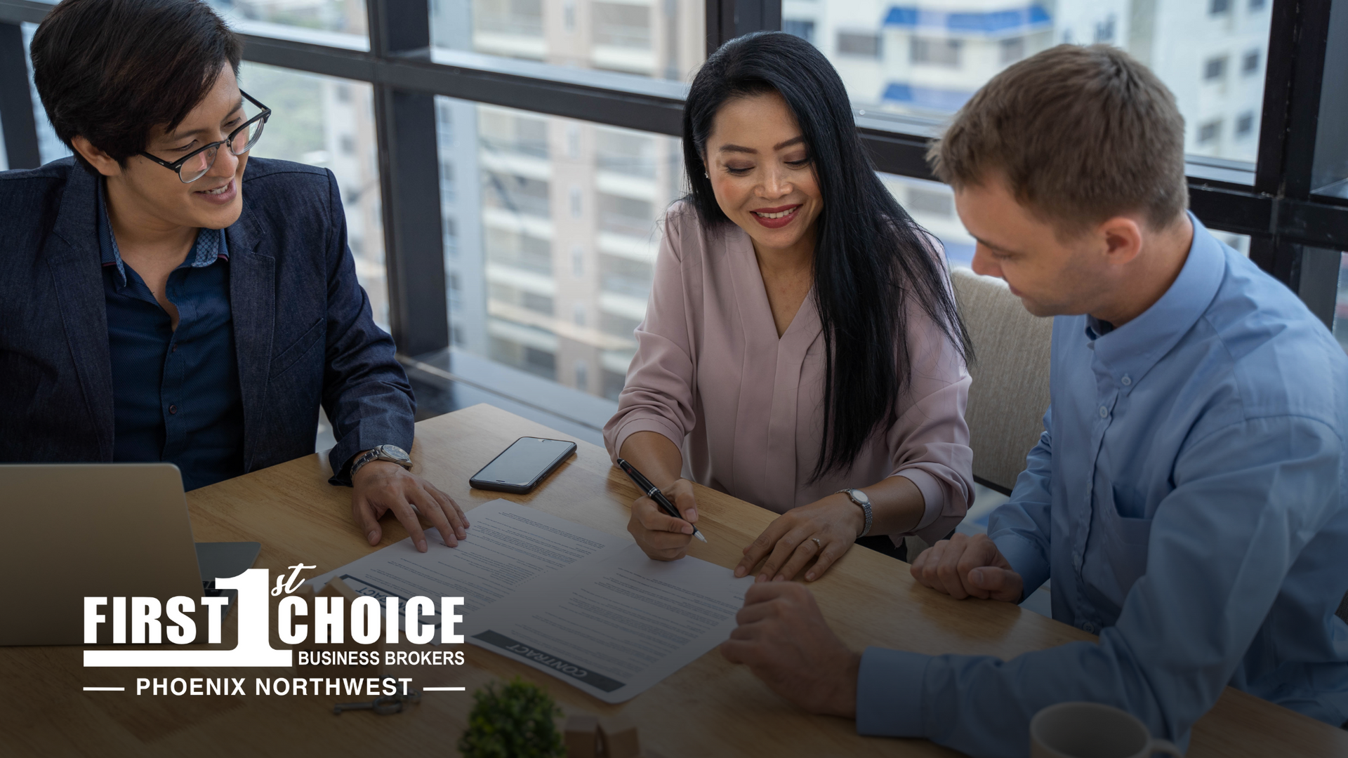 A business broker with he business seller and buyer closing a deal