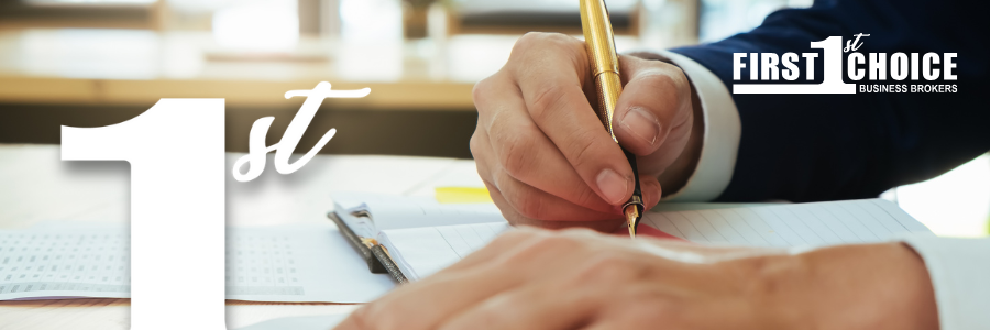A person in a suit is writing with a gold pen. The text 