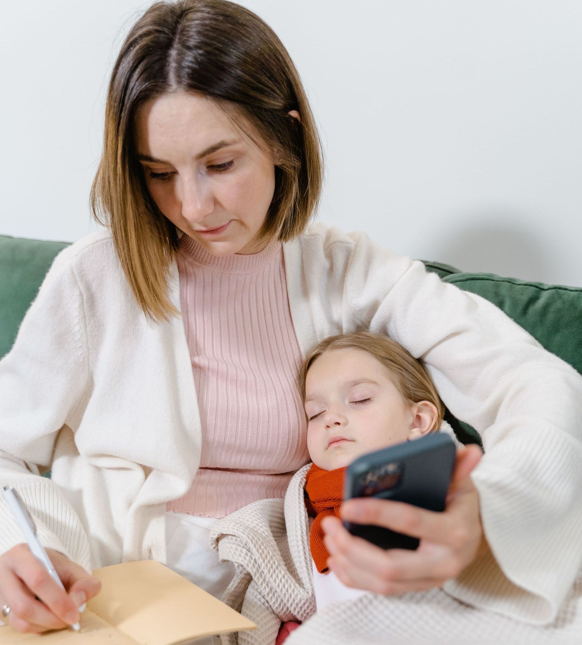 Sick Child sleeping in mom's arms