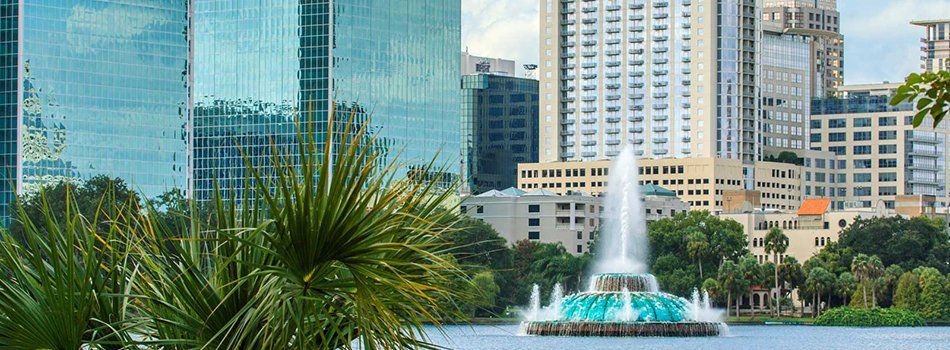 Florida skyline and water fountain | CAM Realty