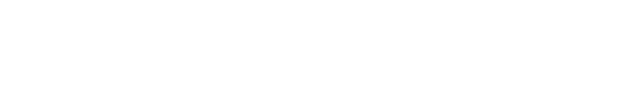 A white, modern floor lamp with a thin, arching metal stem and a spherical, glowing orb light, set on a circular base.