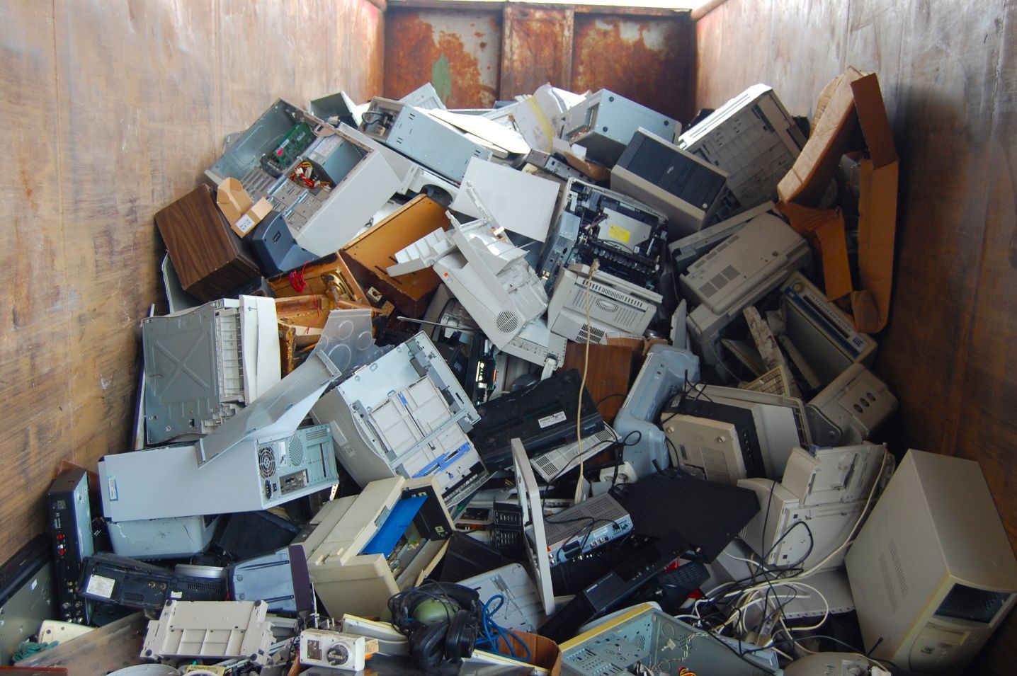 A pile of electronic waste including a printer that says ' epson ' on it