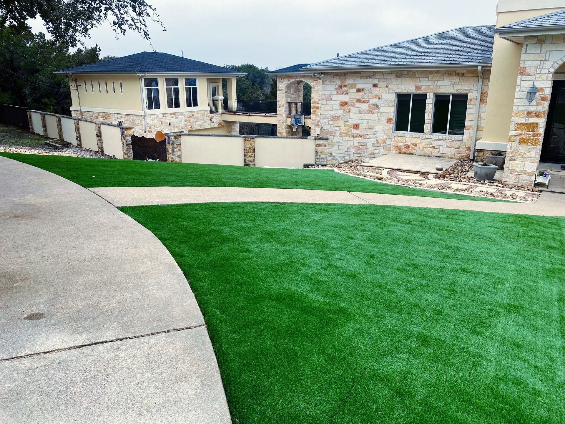 A large house with a lush green lawn in front of it