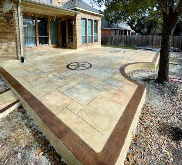 A patio in front of a house with a star on it
