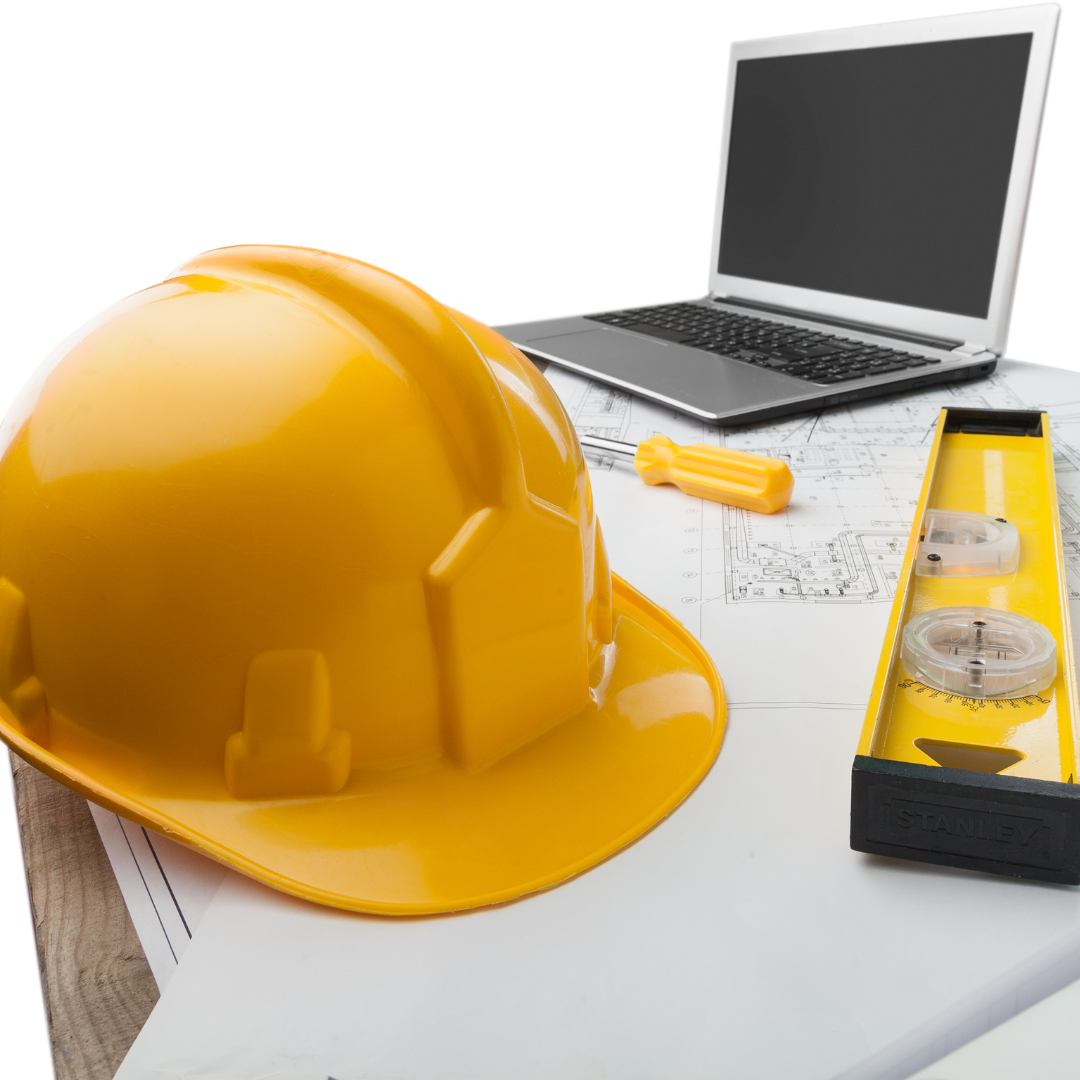 Close-up of a vibrant yellow safety helmet and a yellow level tool on a white surface, with architectural blueprints and a closed laptop in the background, symbolizing construction project planning and design.