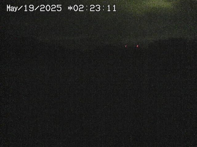 Dark nighttime scene with two faint, red lights in the distance; date and time stamp: May 19, 2025 * 02:23:11.