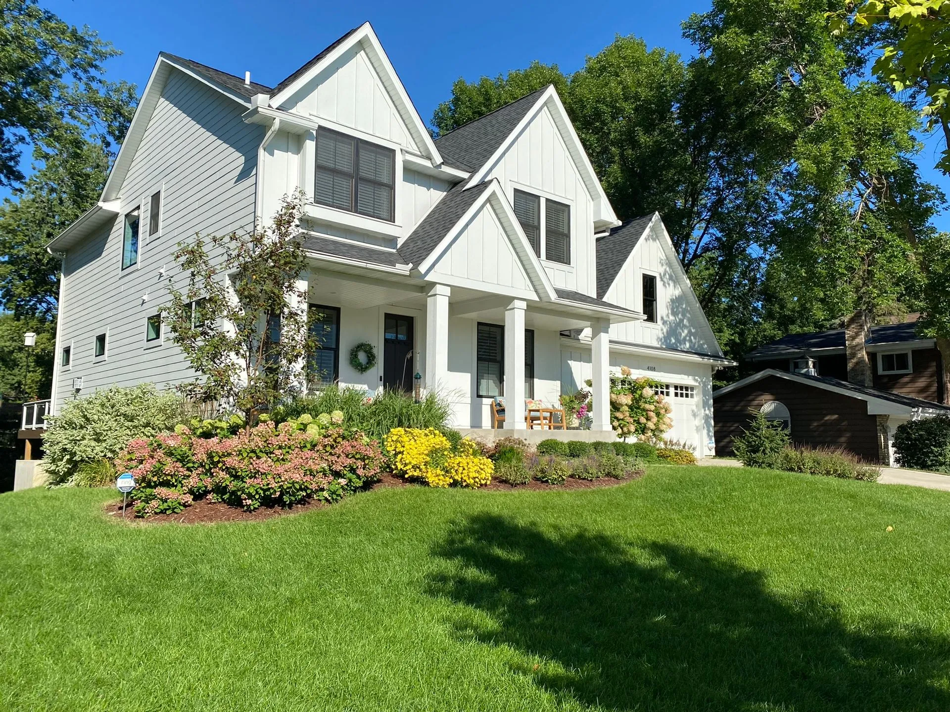Beautiful creative Front Yard Landscaping ideas for new build home with colorful seasonal interest grasses evergreen  texture Edina MN Landscaping Design Contractor KG Landscape  