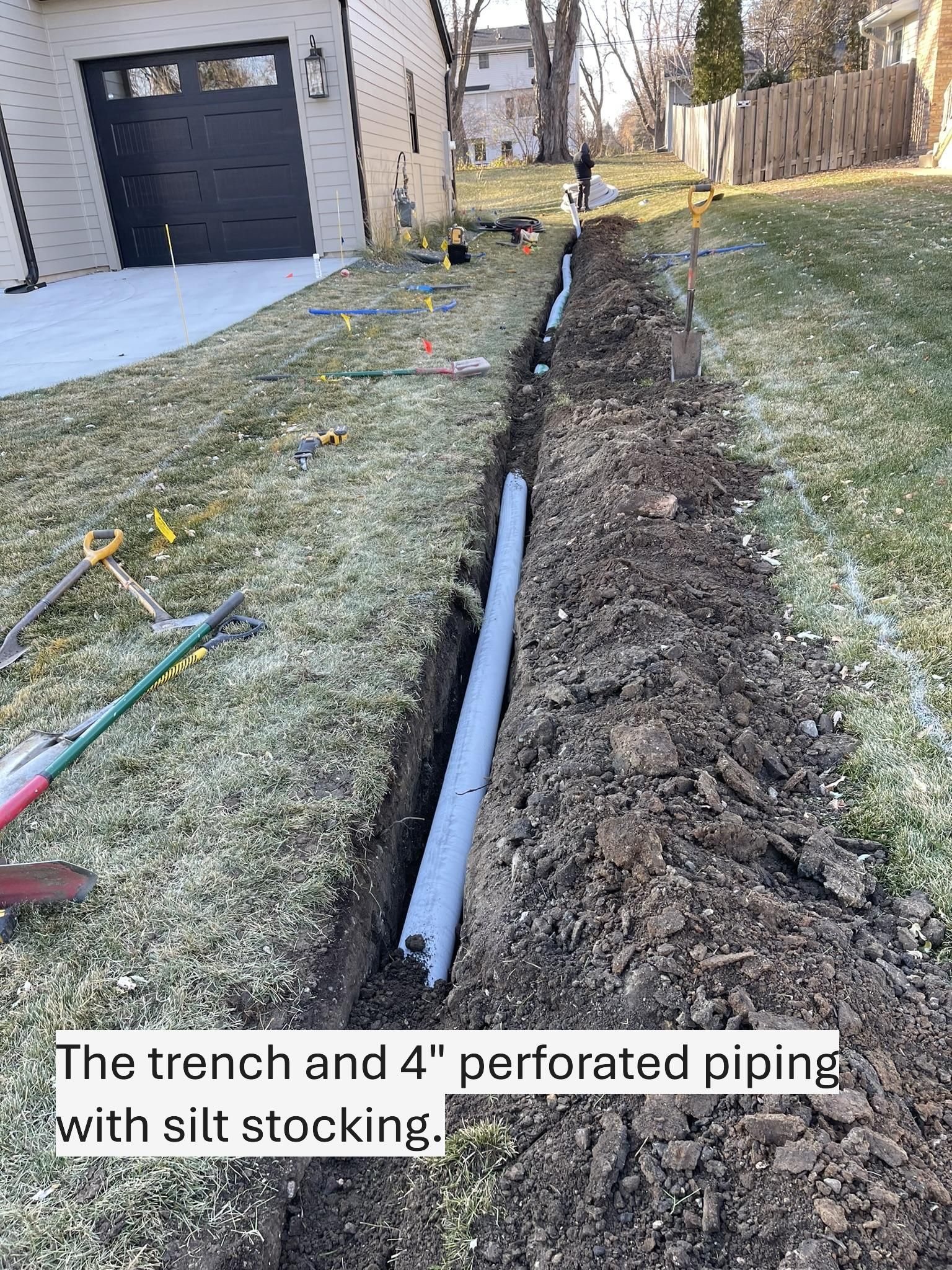 Before picture showing a clogged channel drain in driveway 