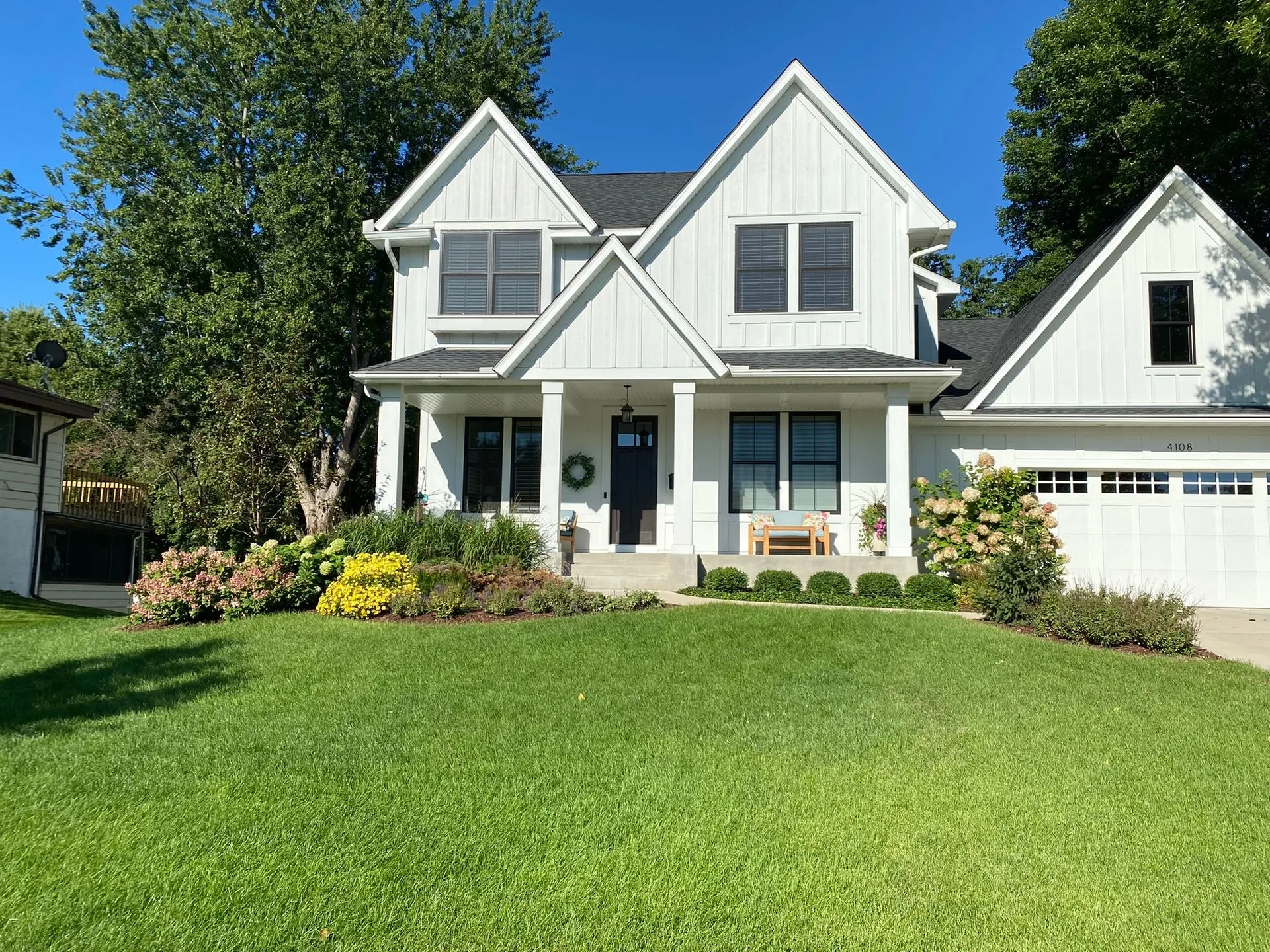 Front Yard Landscaping ideas with colorful seasonal interest grasses evergreen  texture Edina MN Landscaping Design Contractor KG Landscape  