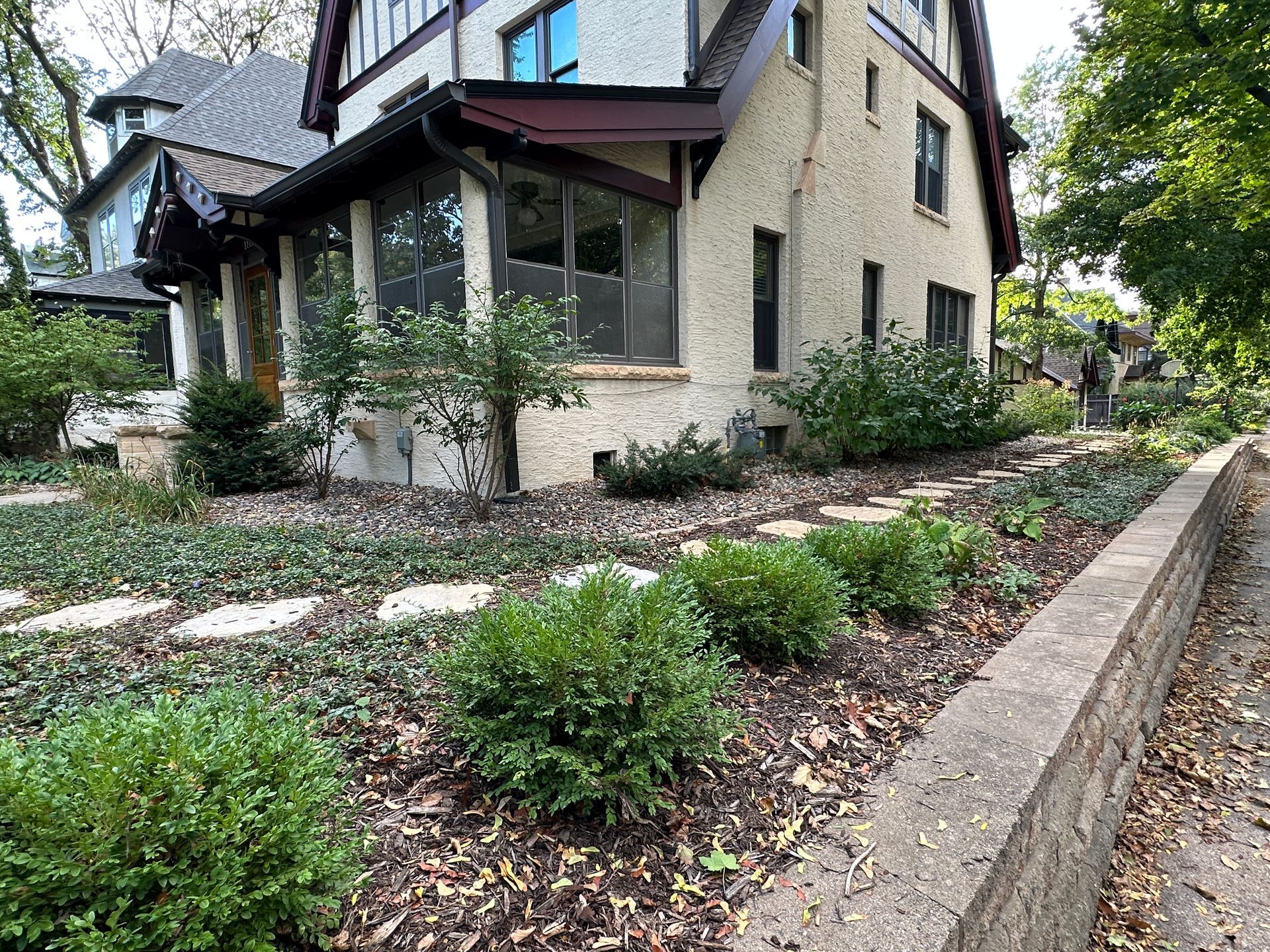 After photo one year later showing new retaining wall along the entire side yard in Minneapolis by KG Landscape