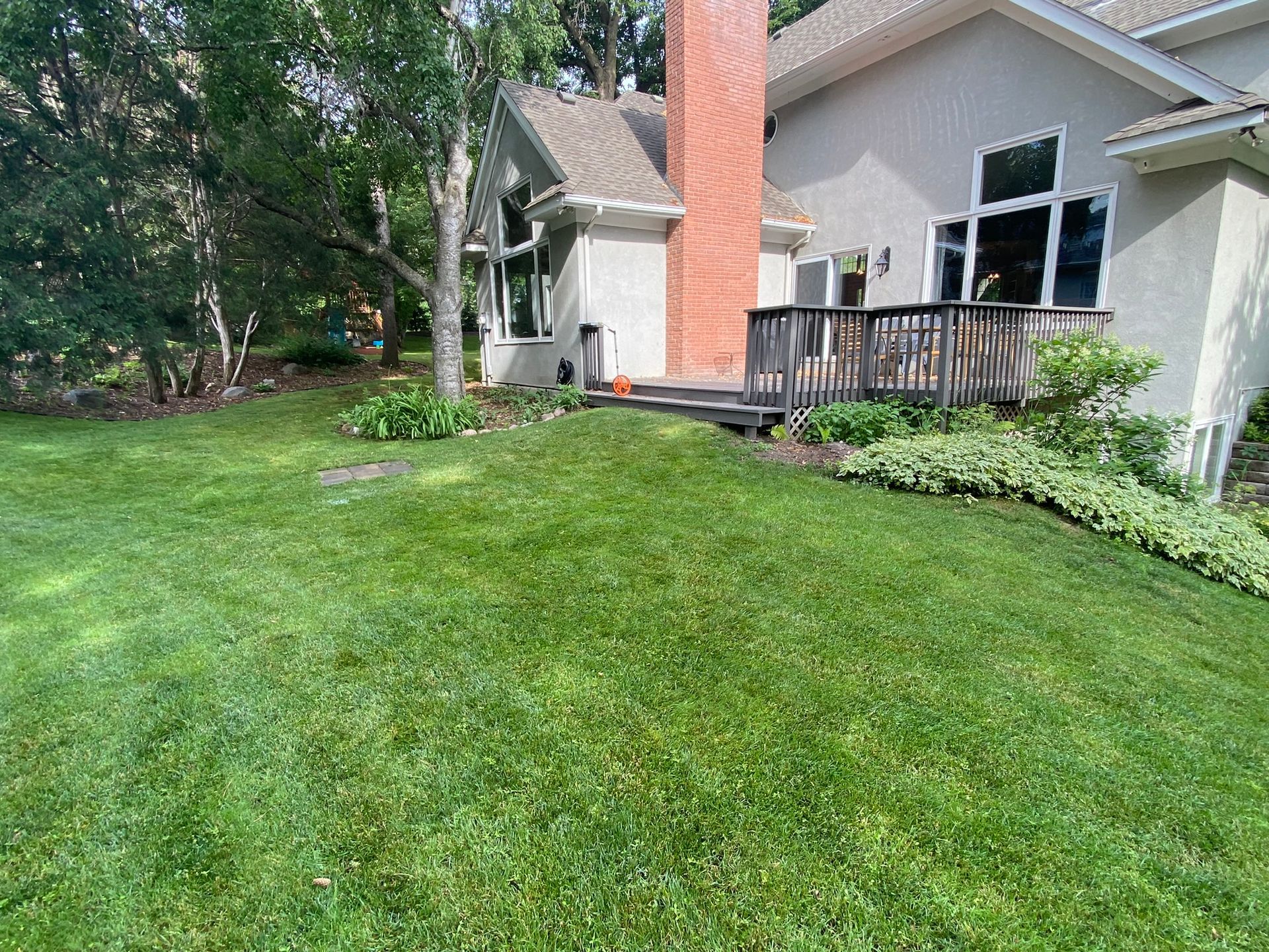 Before picture of a backyard in Minnetonka that needs a new outdoor living space 