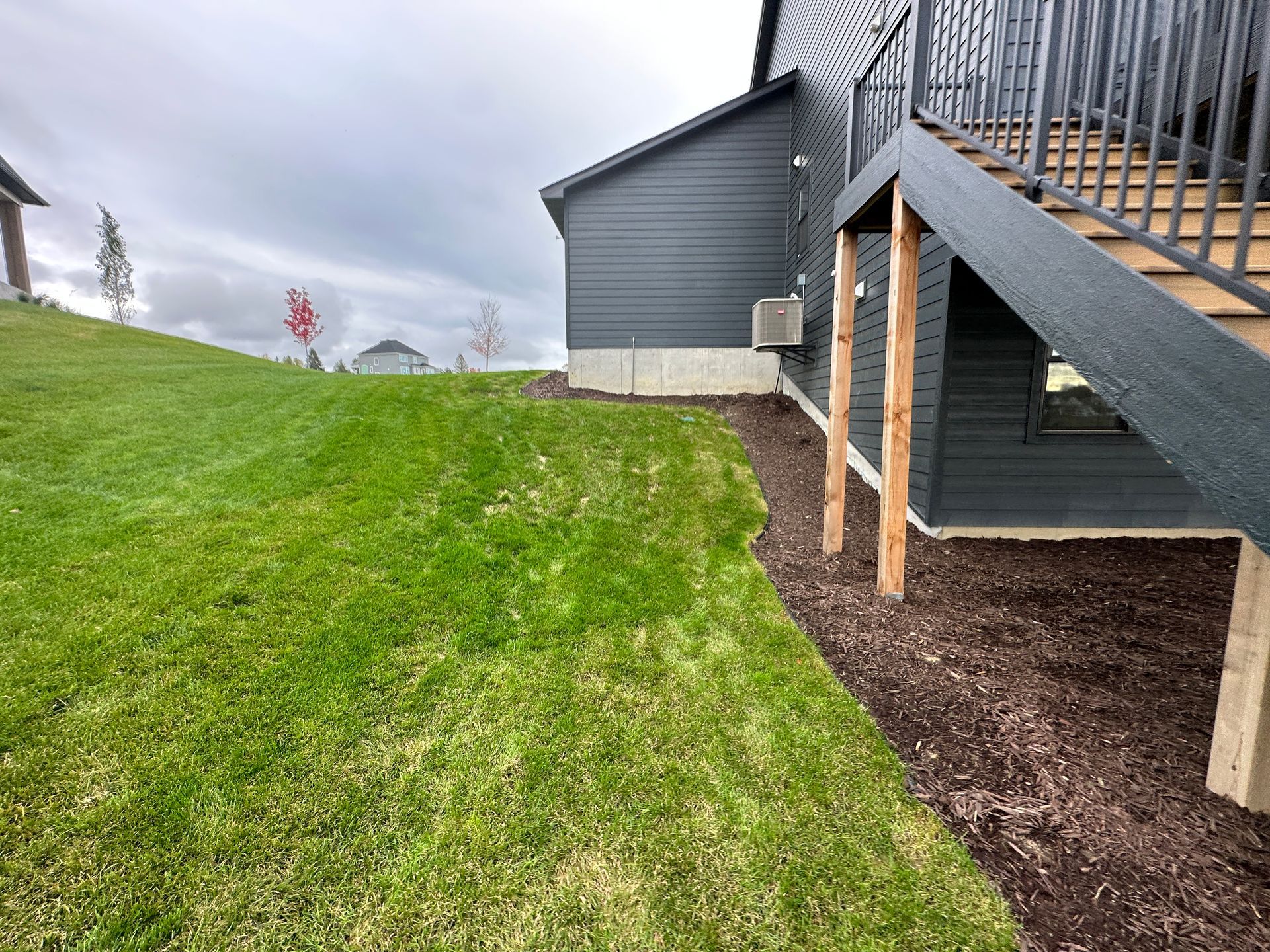 Before unused side yard hill space for walkout basemenet home