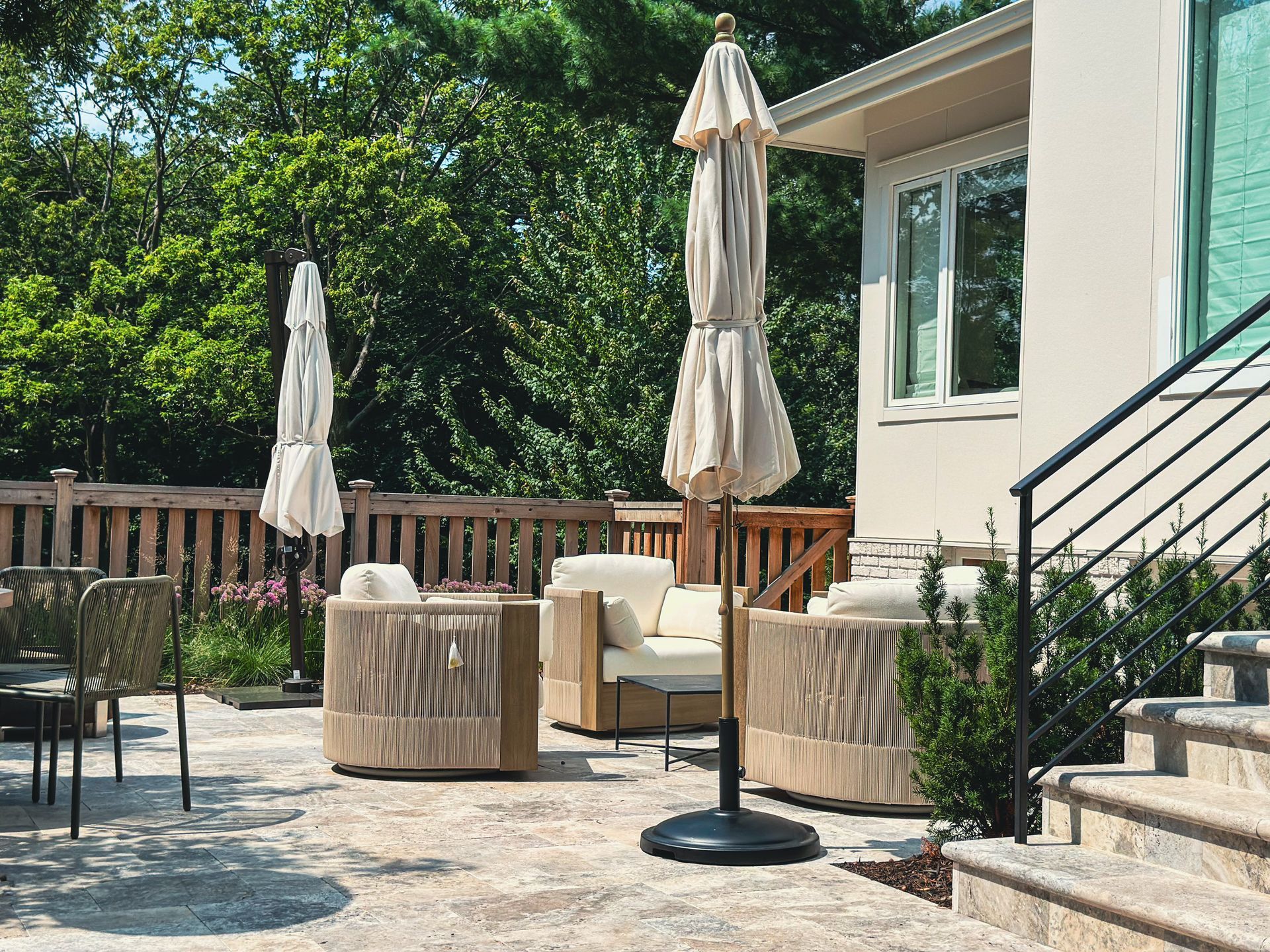 After: new backyard patio with travertine natural stone and custom matching patio door step with landing  