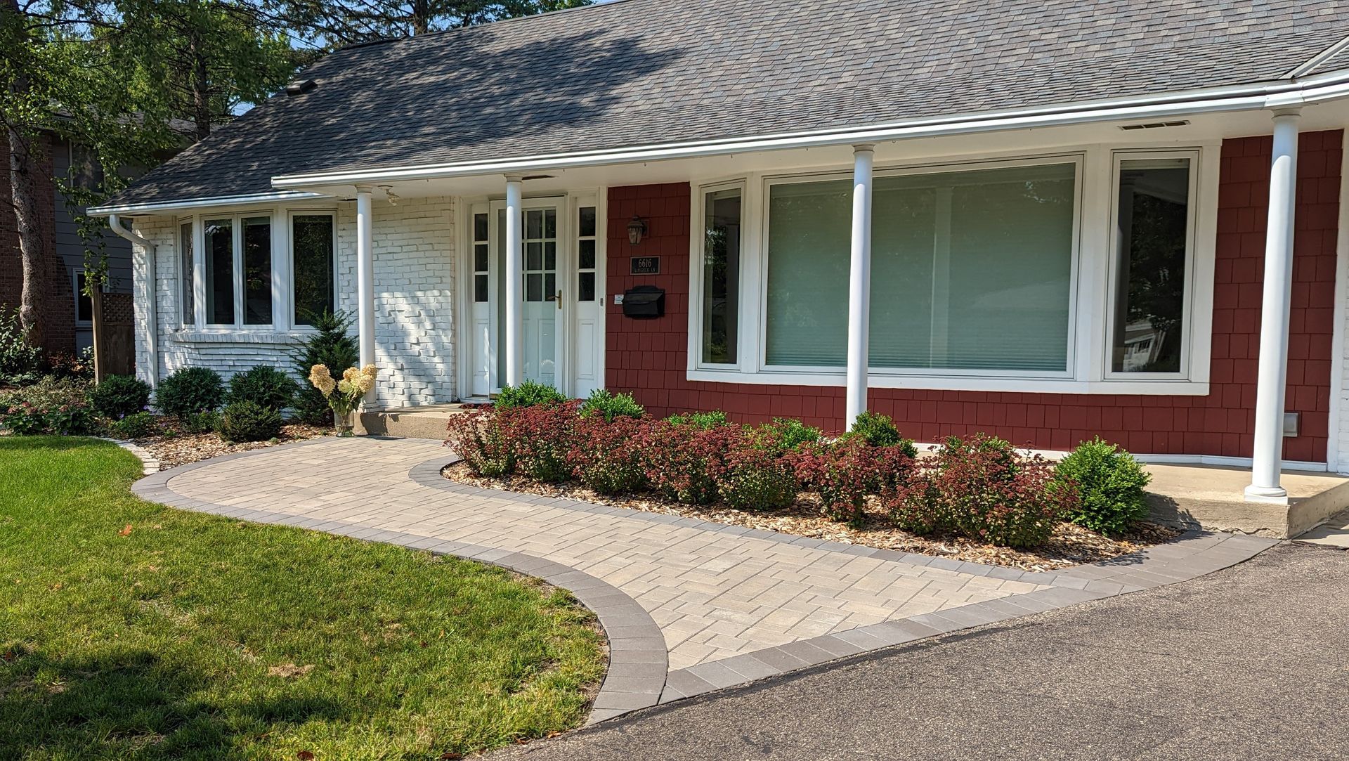 Curb appeal Paver walkway to front door Edina MN KG Landscape Design Installation Contractor double martini sedum with boxwoods