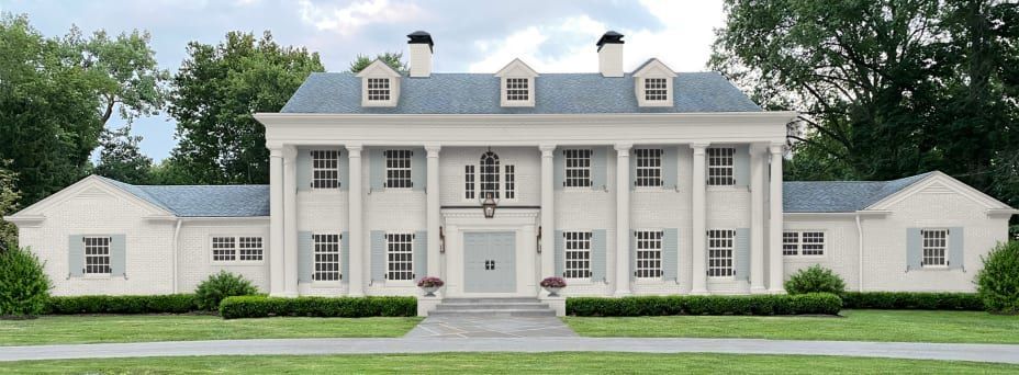 A large white house with a blue roof