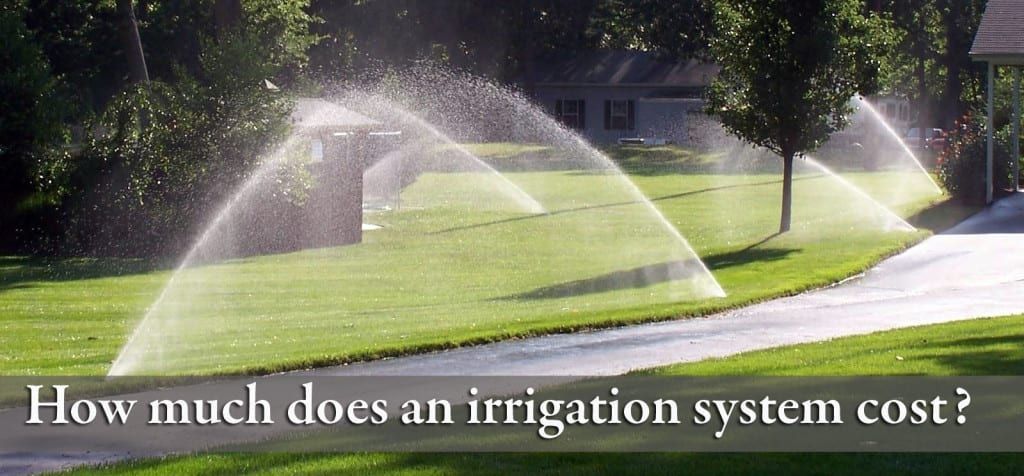 Sprinklers spraying water on a lush green lawn with the words how much does an irrigation system cost