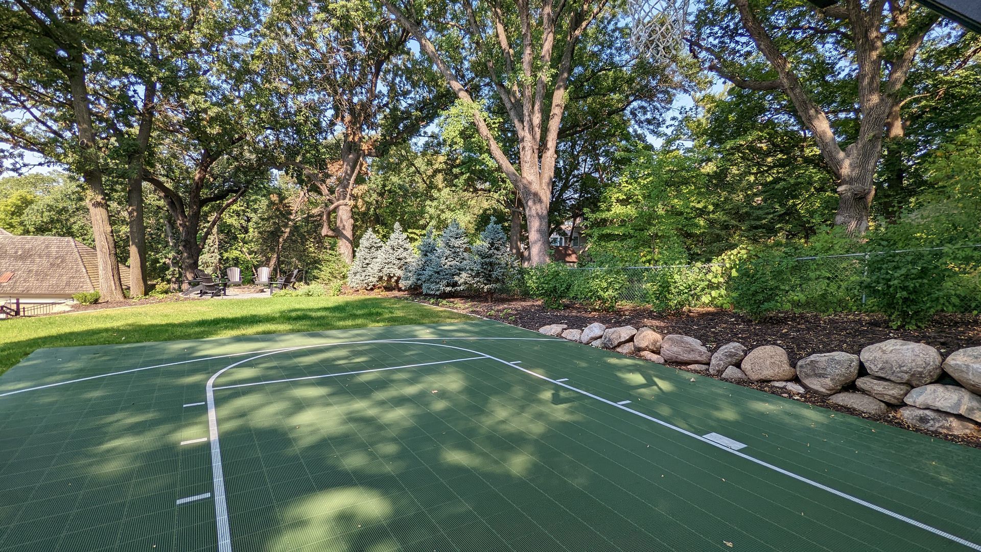 Creating a flat space for a sport court on a hill in MN