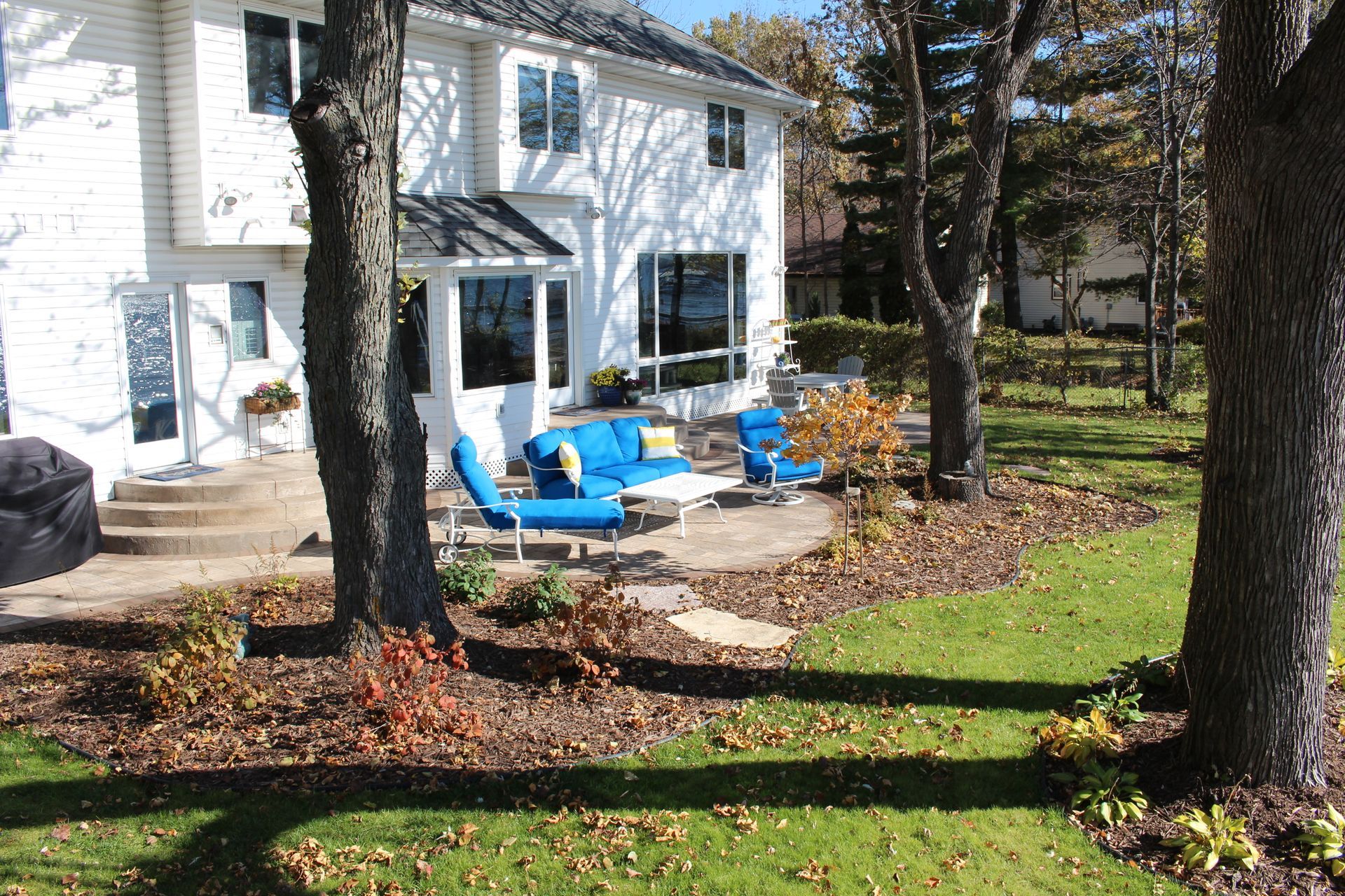 Designed+Paver+patio+with+half+cirlce+round+steps+designed+by+KG+Landscape+on+Forst+Lake+MN-