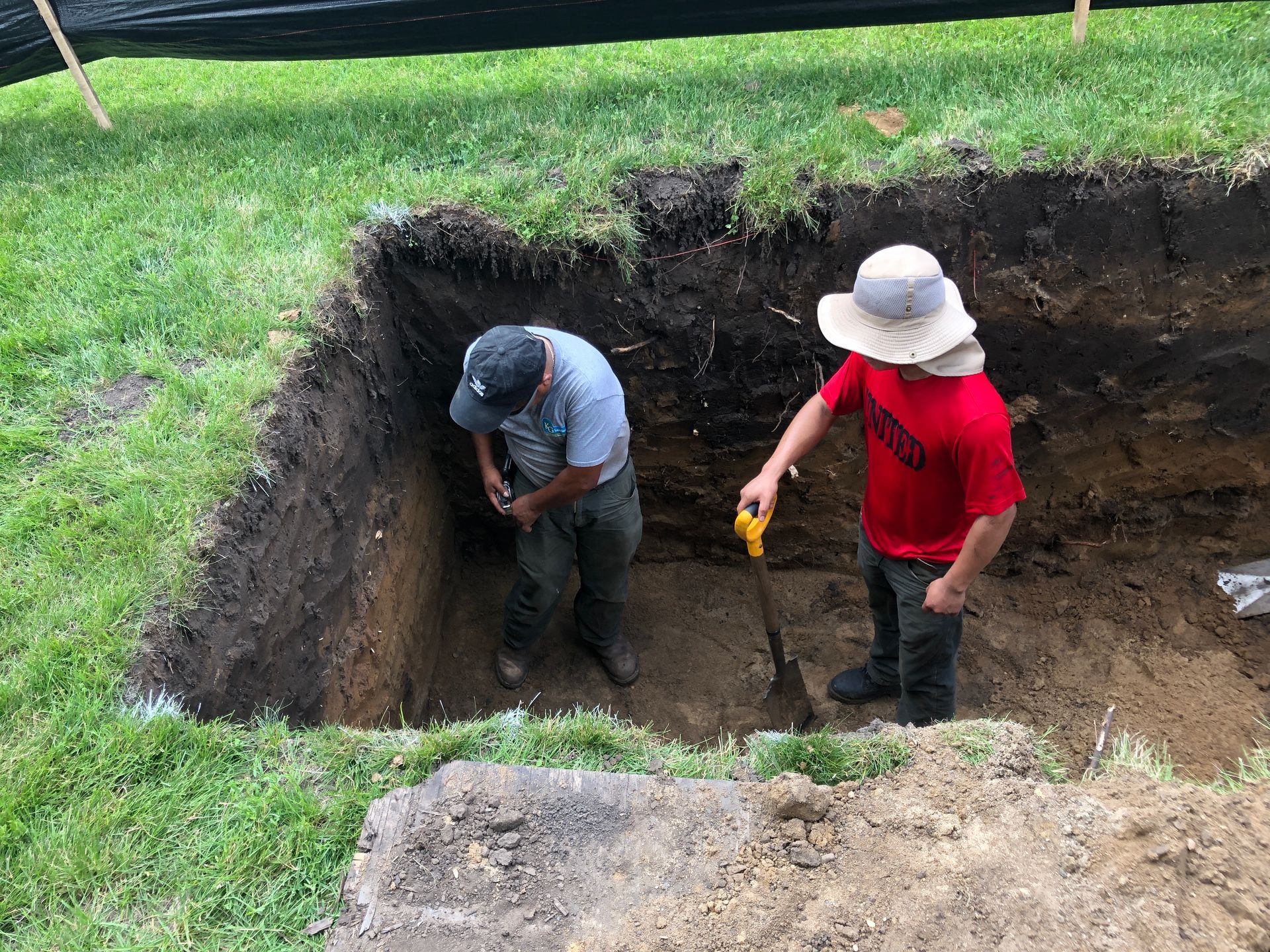 Crew standing in dry well basin 