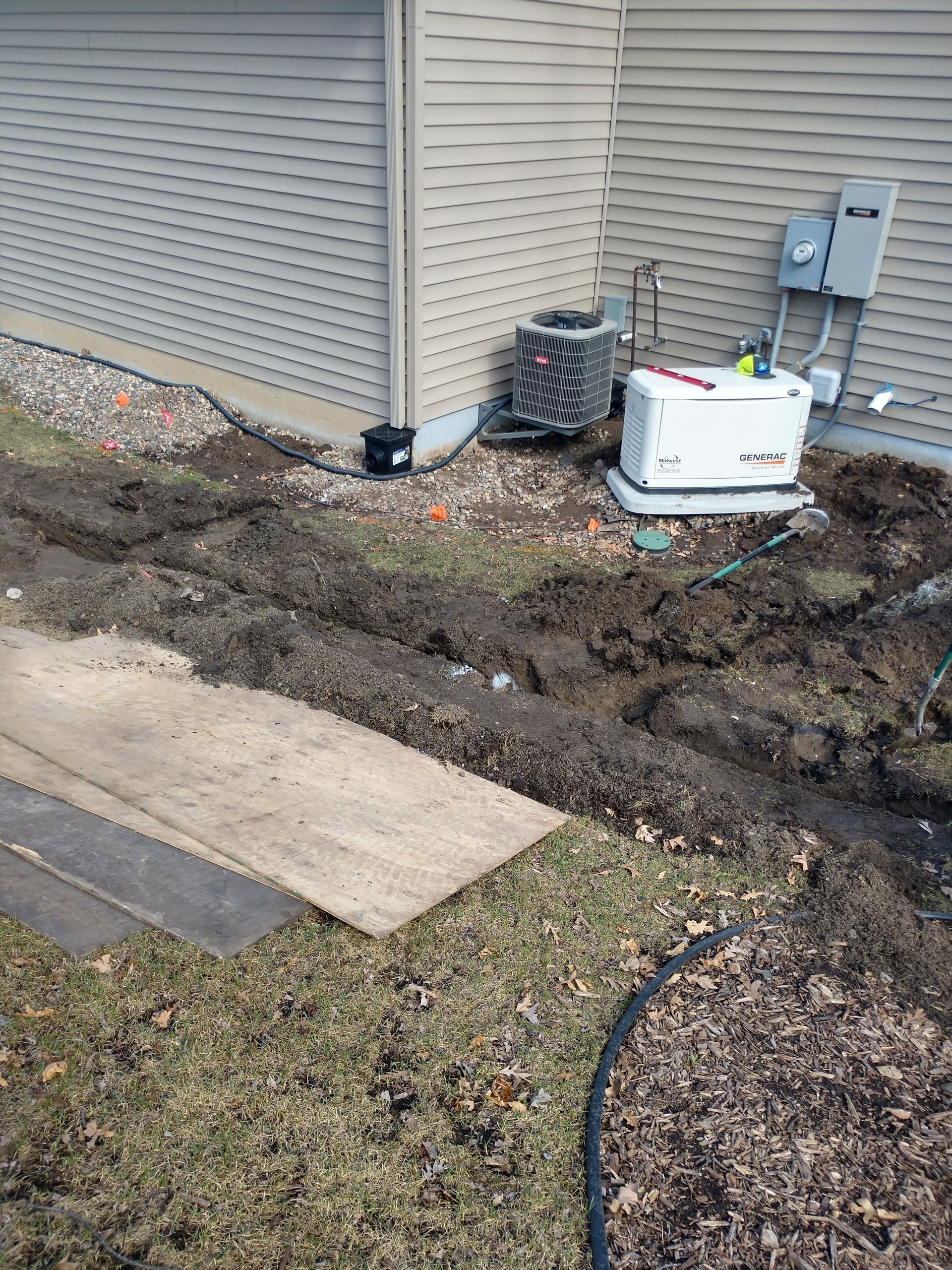 Our crew starting to install the trenches for new underground downspout catch basins and drain pipe