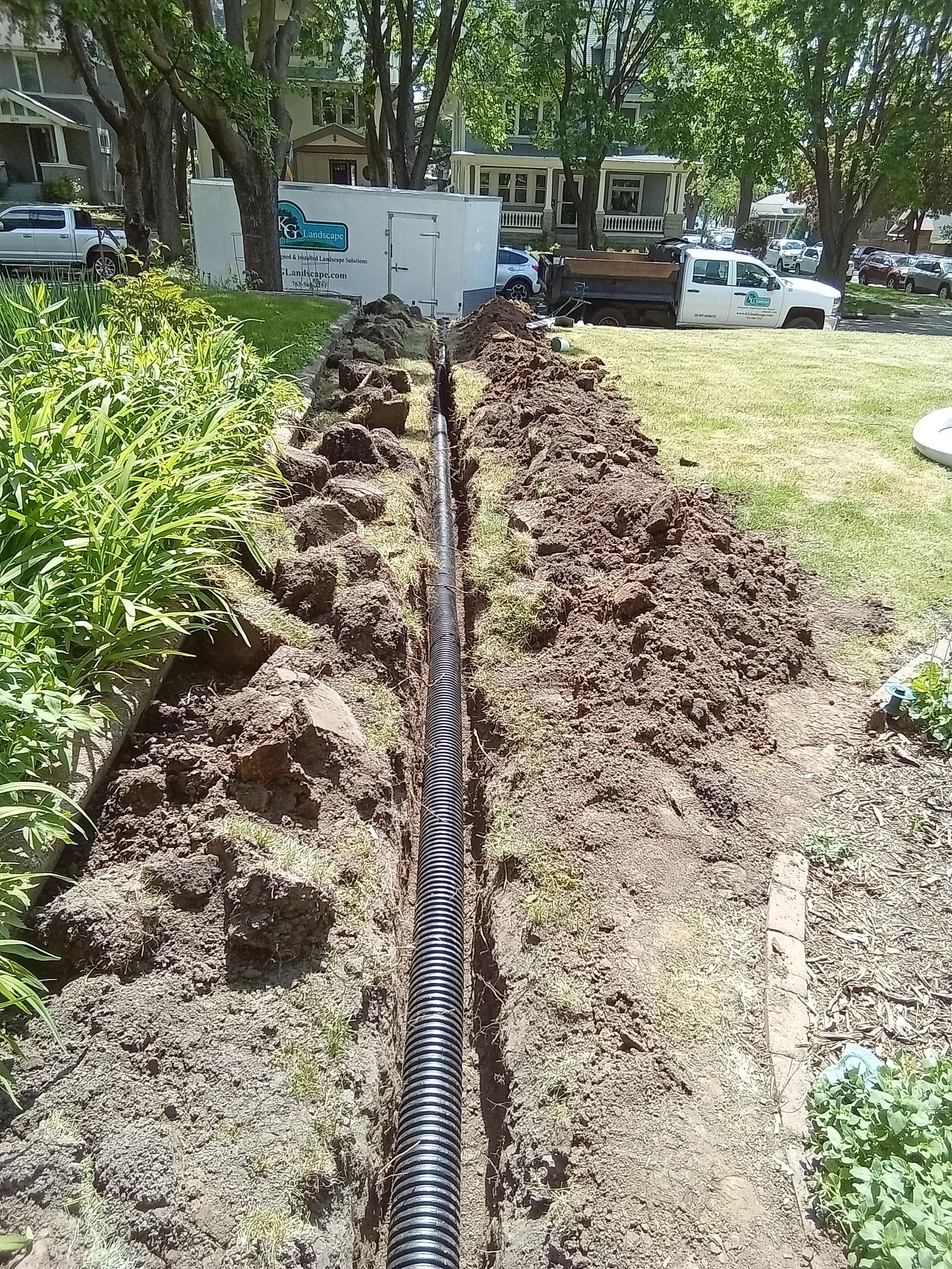 During: KG crew installing underground drain pipe
