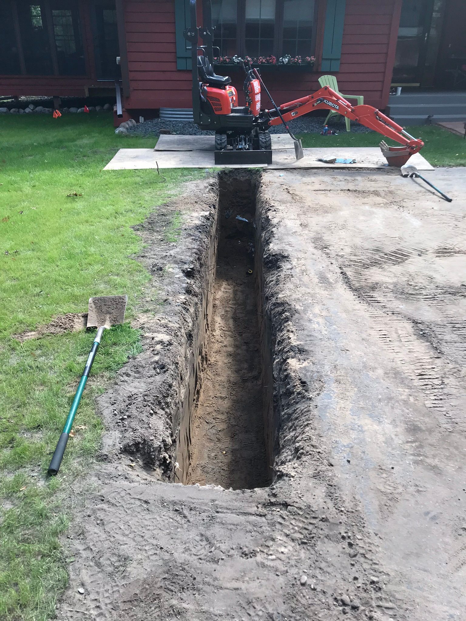 Excavator+digging+a+deep+French+drain+dry+well+for+Draiange+solution+Minneapolis+MN+KG+Landscape