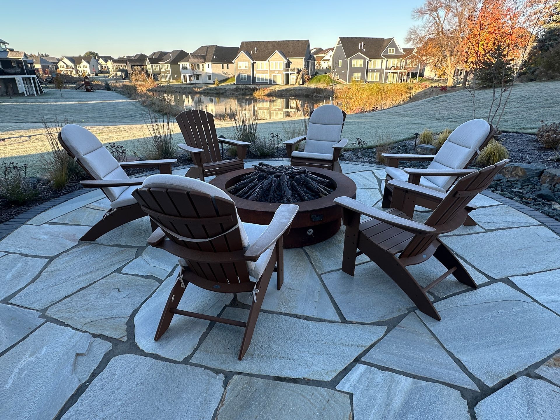 Fire pit conversation area in backyard