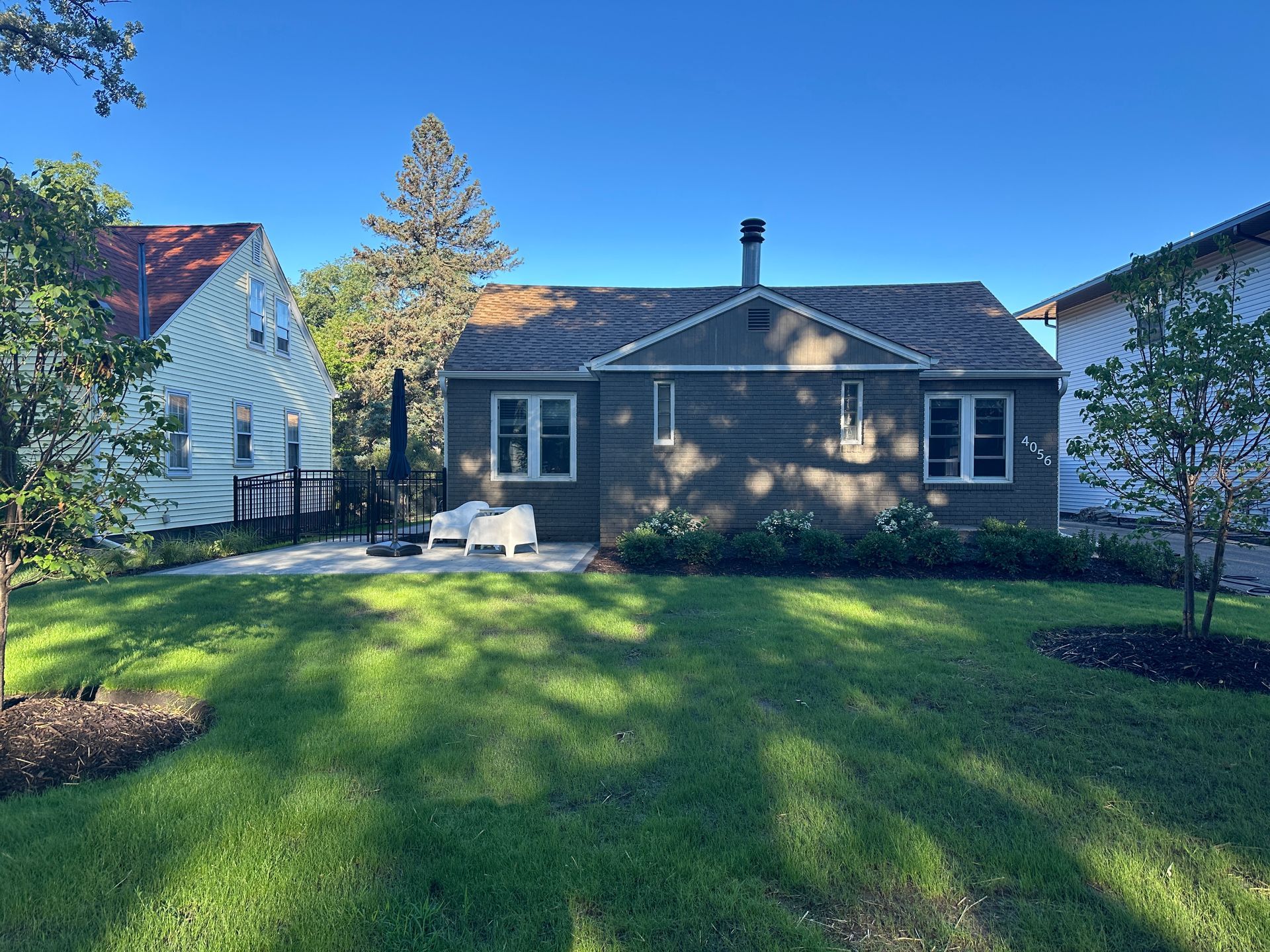 A front-facing view of a house after new landscaping.