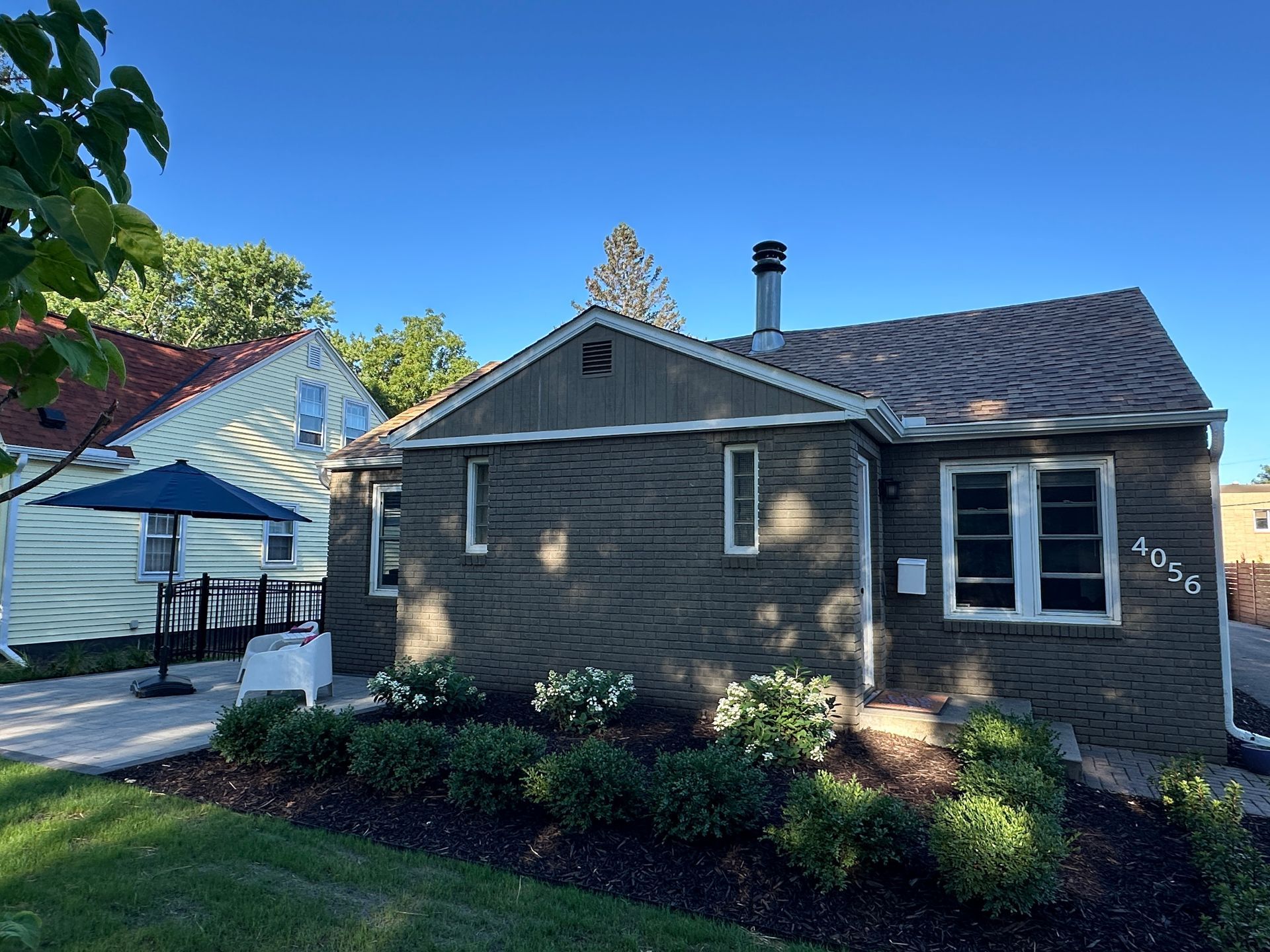 The mighty old tree gives way to an attractive and less dangerous array of greenery.