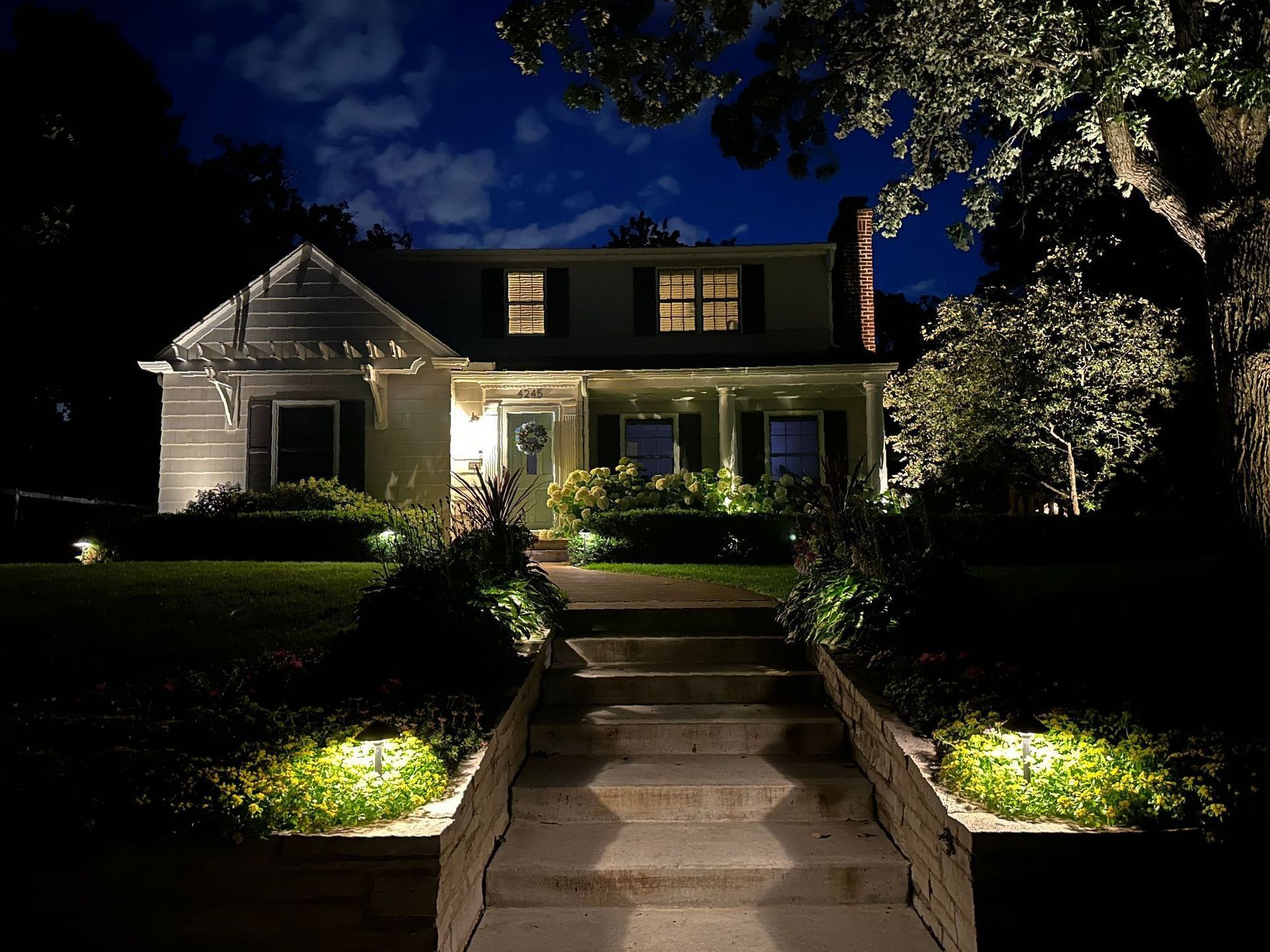 Landscape lighting front yard steps pathway lights up-lights on house and tree St. Louis Park MN KG Landscape