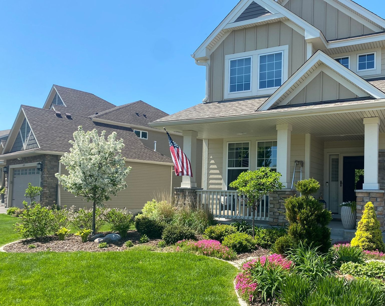Front yard landscaping lots of perennial flowers beautiful Blaine MN KGLandscape.com 