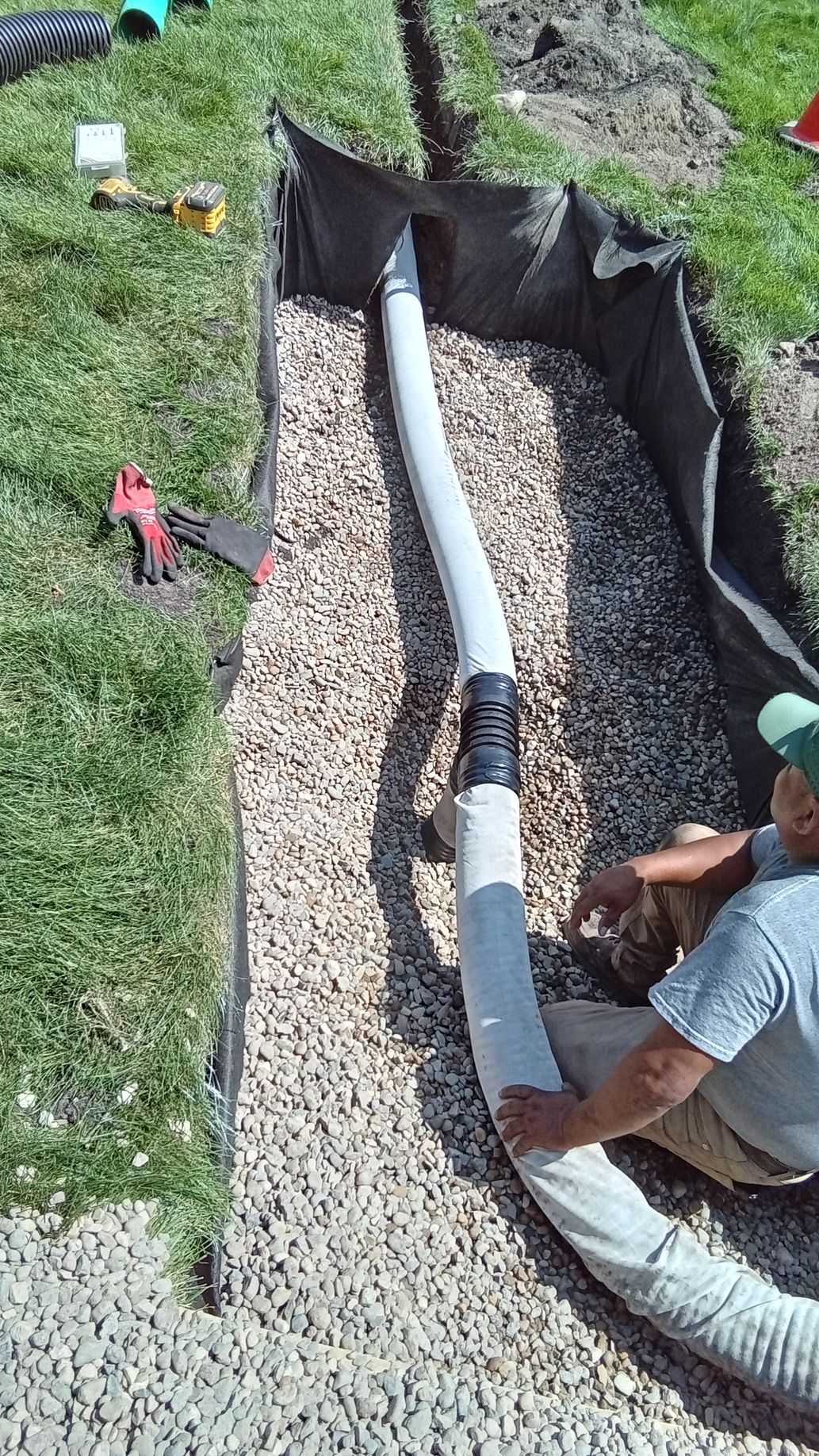 During: installing a T where drain the pipe from sump discharge runs directly to the bottom of dry well
