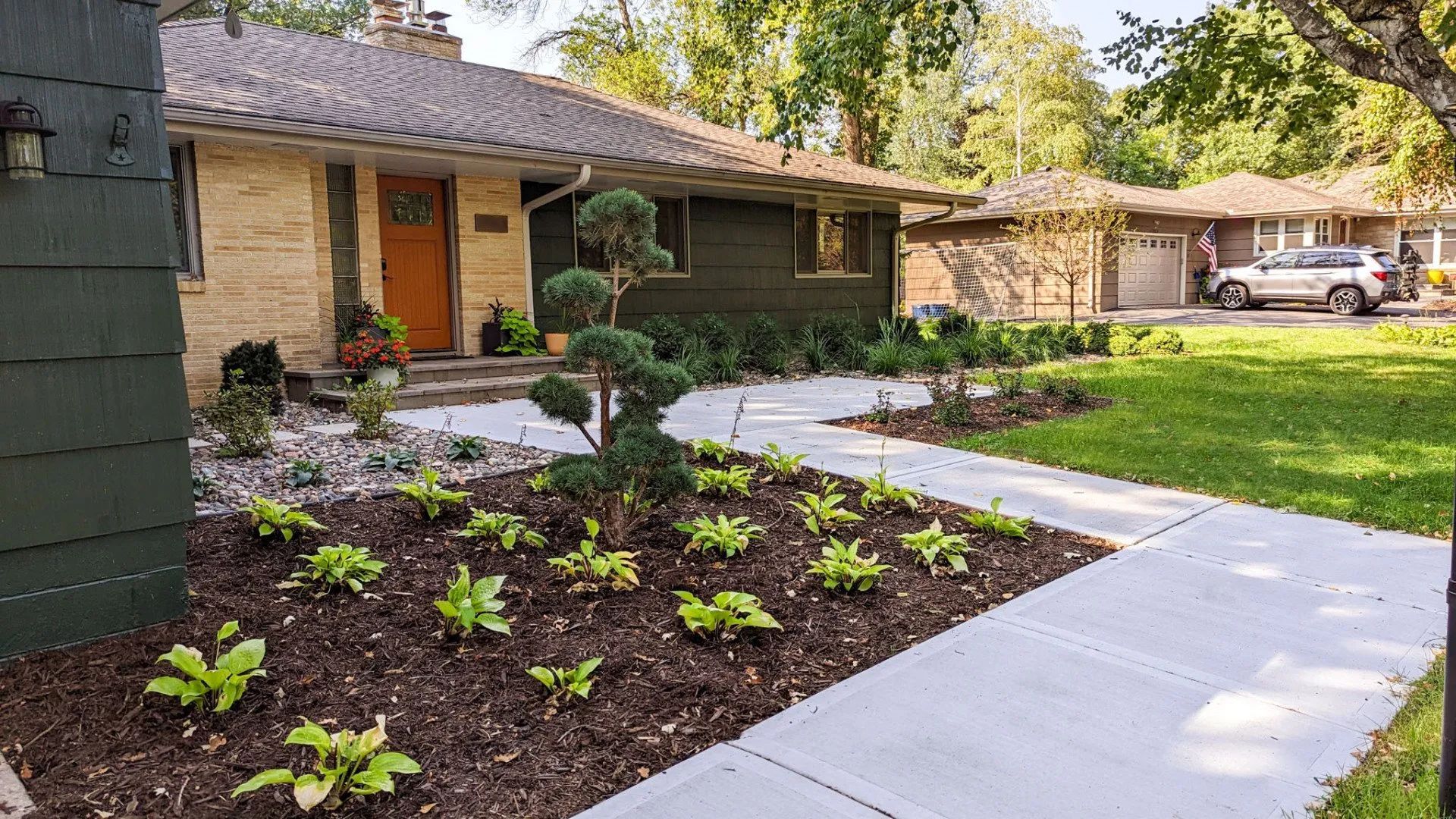 mid century modern landscaping design company KG Landscape MN with topiary focal point 