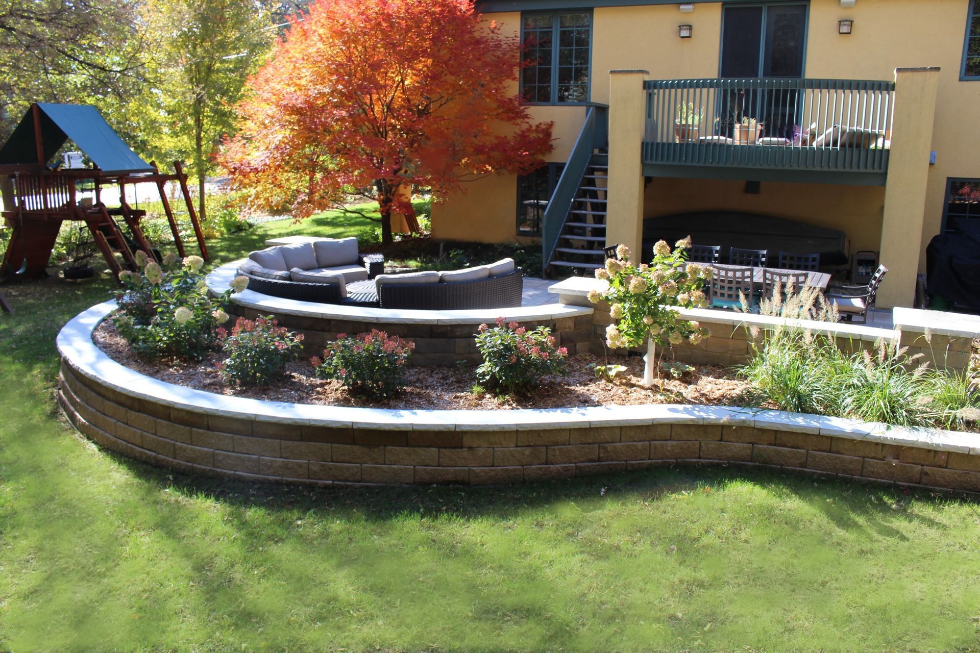 Raised+paver+patio+off+a+deck+sitting+wall+and+retaining+wall+Minneapolis+MN+KG+Landscape