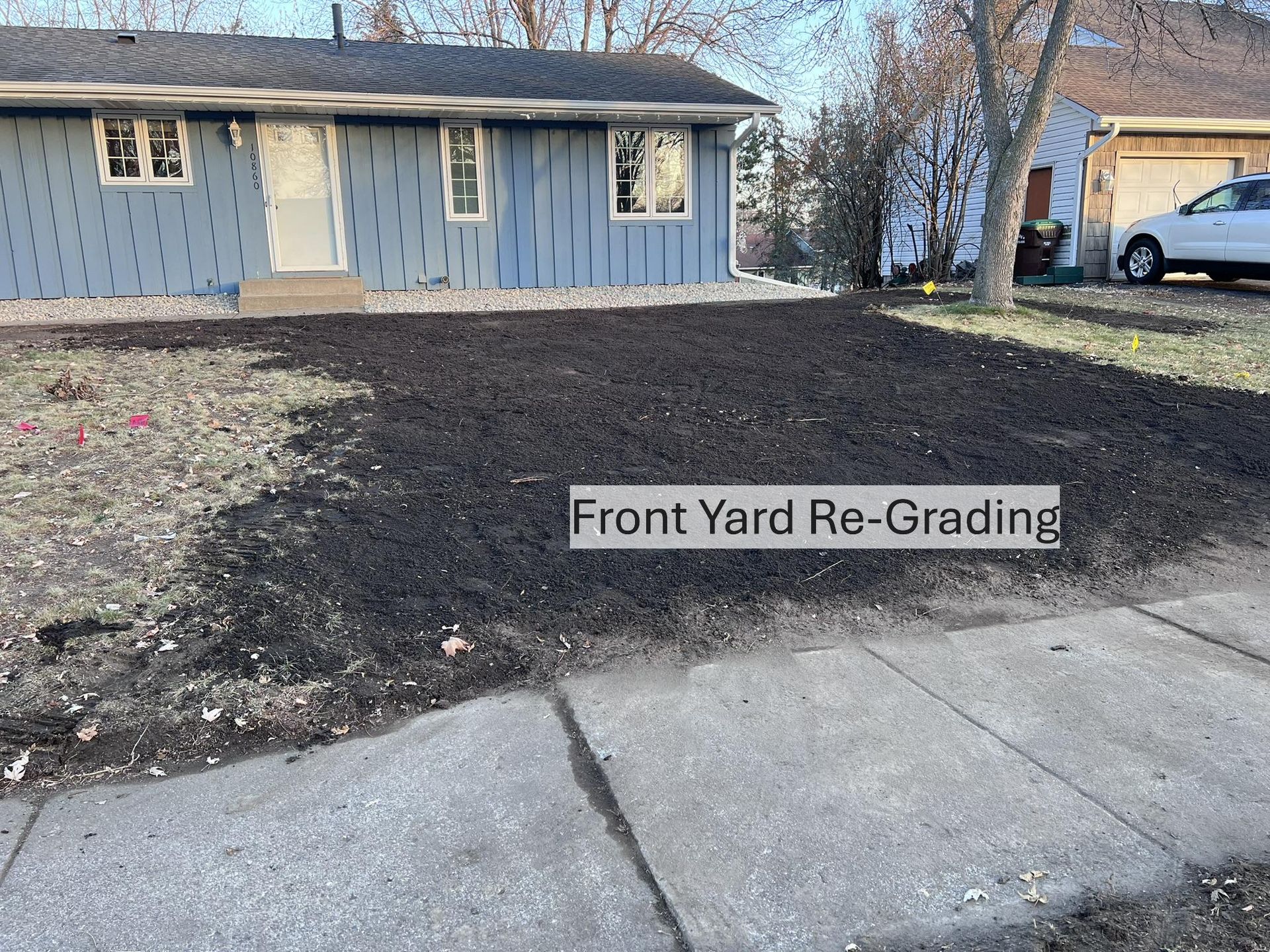 Front Yard regrading fresh topsoil ready to seed proper drainage MN KG Landscape 