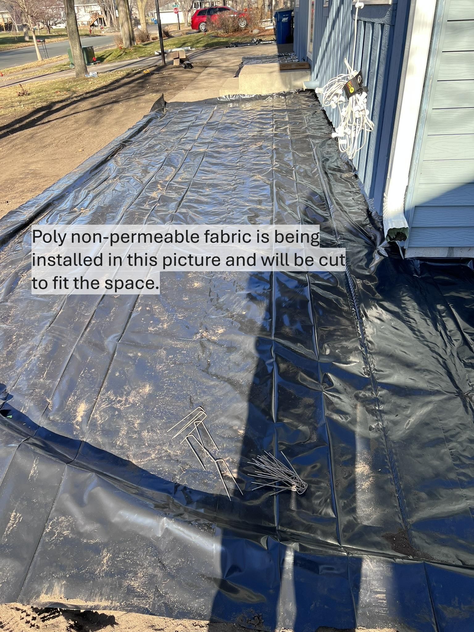 Poly+Non-permeable+plastic+Fabric+liner+Installation+in+Rock+Beds+MN+KG+Landscape