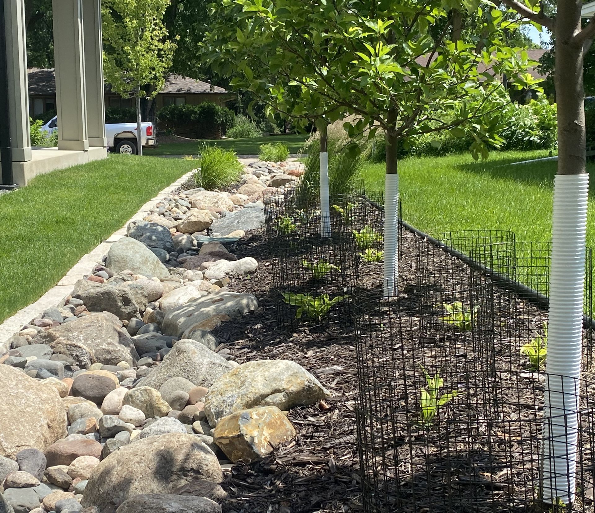Dry+Creek+Bed+stream+bed+drainage+repair+landscaping+curb+appeal+sump+line+Edina+MN+KG+Landscape