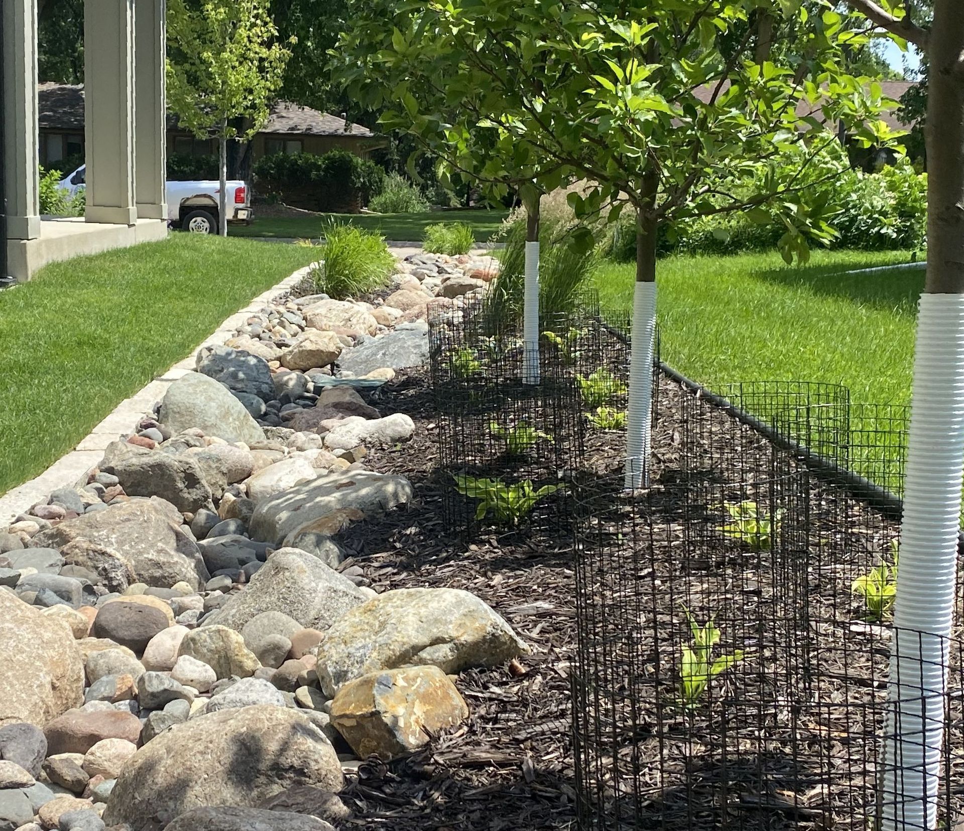 Side+Yard+Dry+Creek+Bed+river+rock+boudlers+drainage+solution+front+yard+landscaping+Edina+MN+KG+Landscape